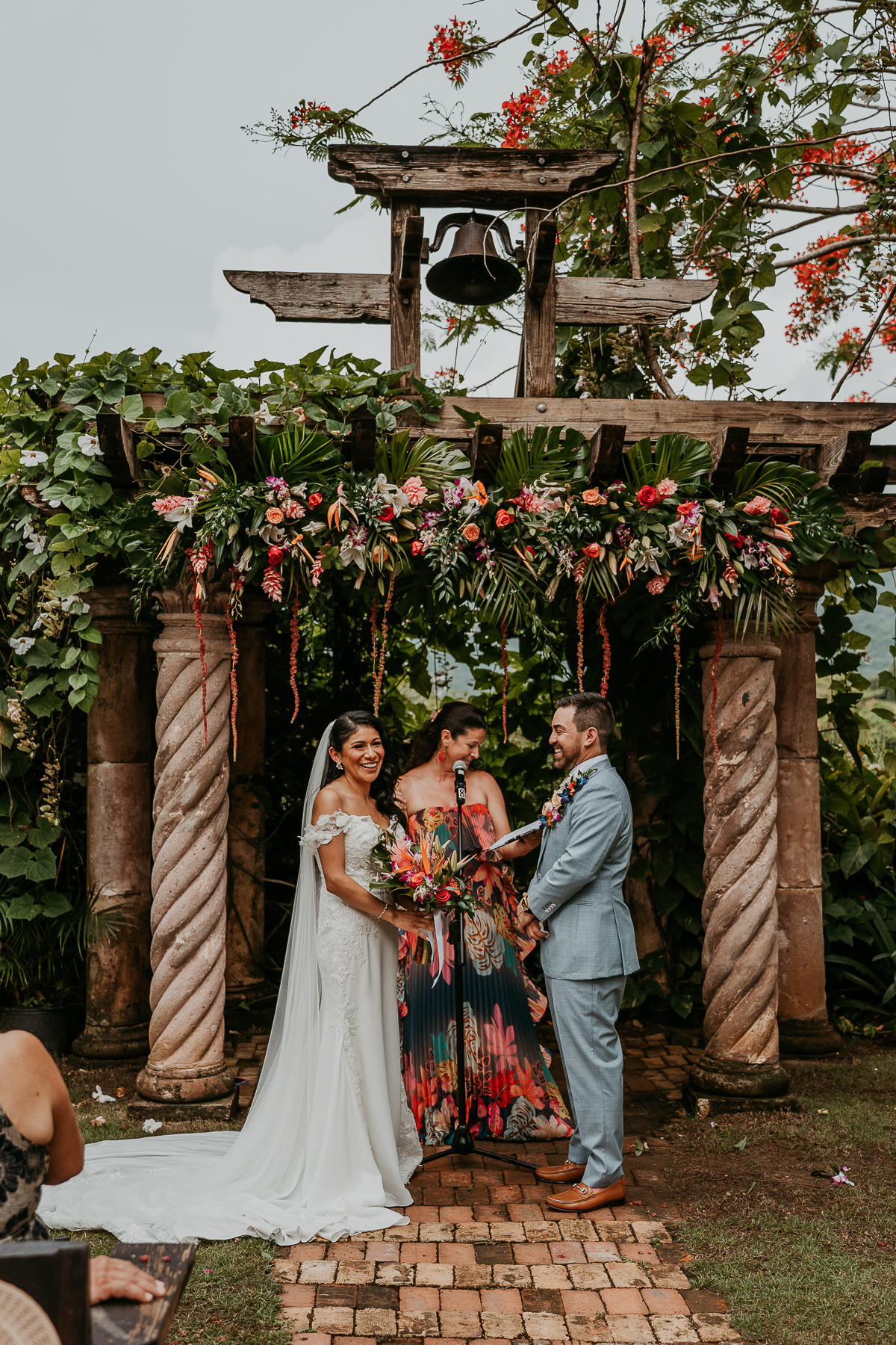 Romantic twilight wedding ceremony at Hacienda Siesta Alegre with guests seated under twinkling lights and lush greenery.