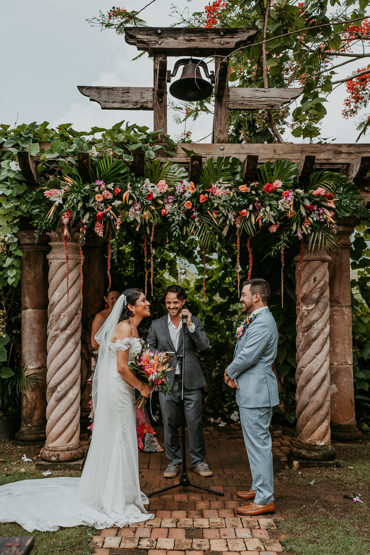 Romantic twilight wedding ceremony at Hacienda Siesta Alegre with guests seated under twinkling lights and lush greenery.