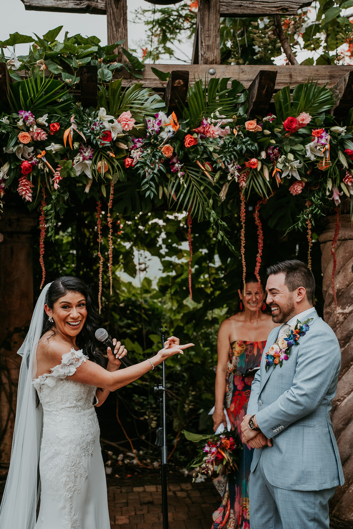 Romantic twilight wedding ceremony at Hacienda Siesta Alegre with guests seated under twinkling lights and lush greenery.