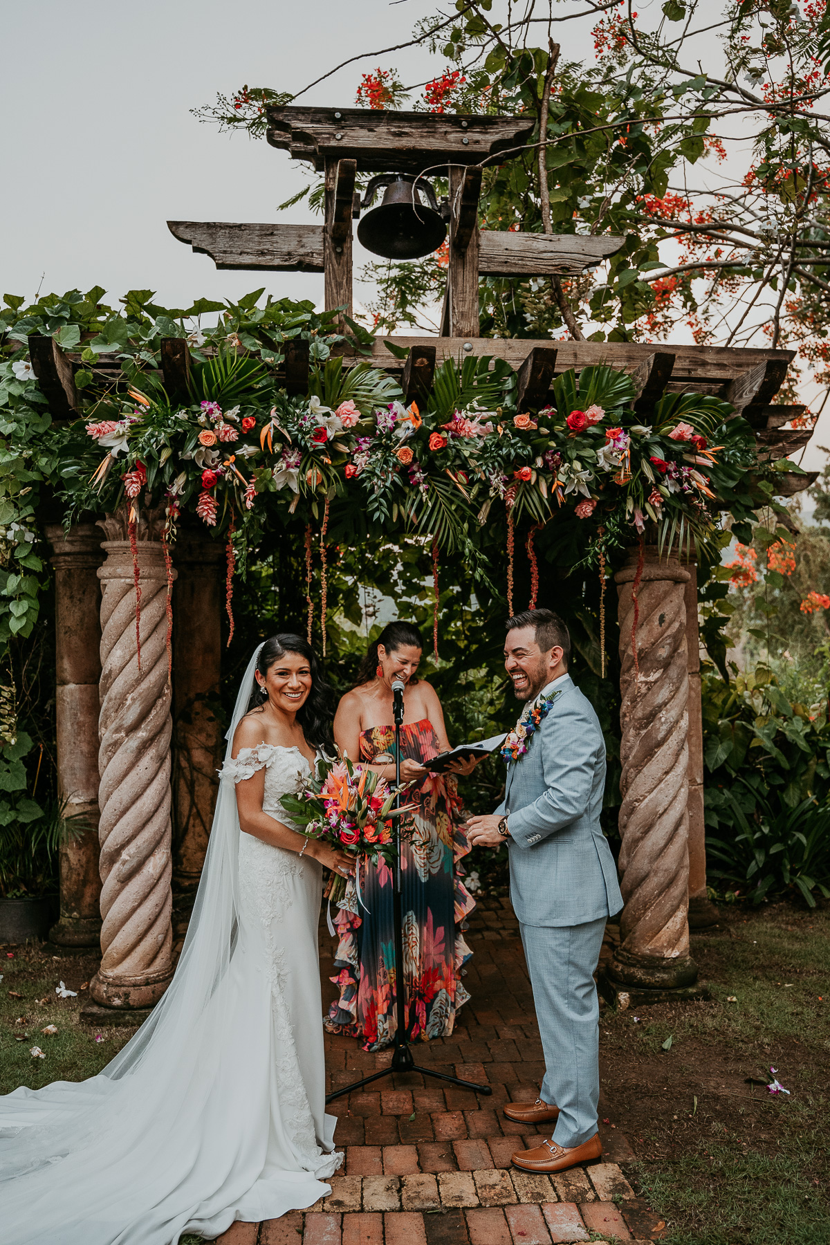 Romantic twilight wedding ceremony at Hacienda Siesta Alegre with guests seated under twinkling lights and lush greenery.