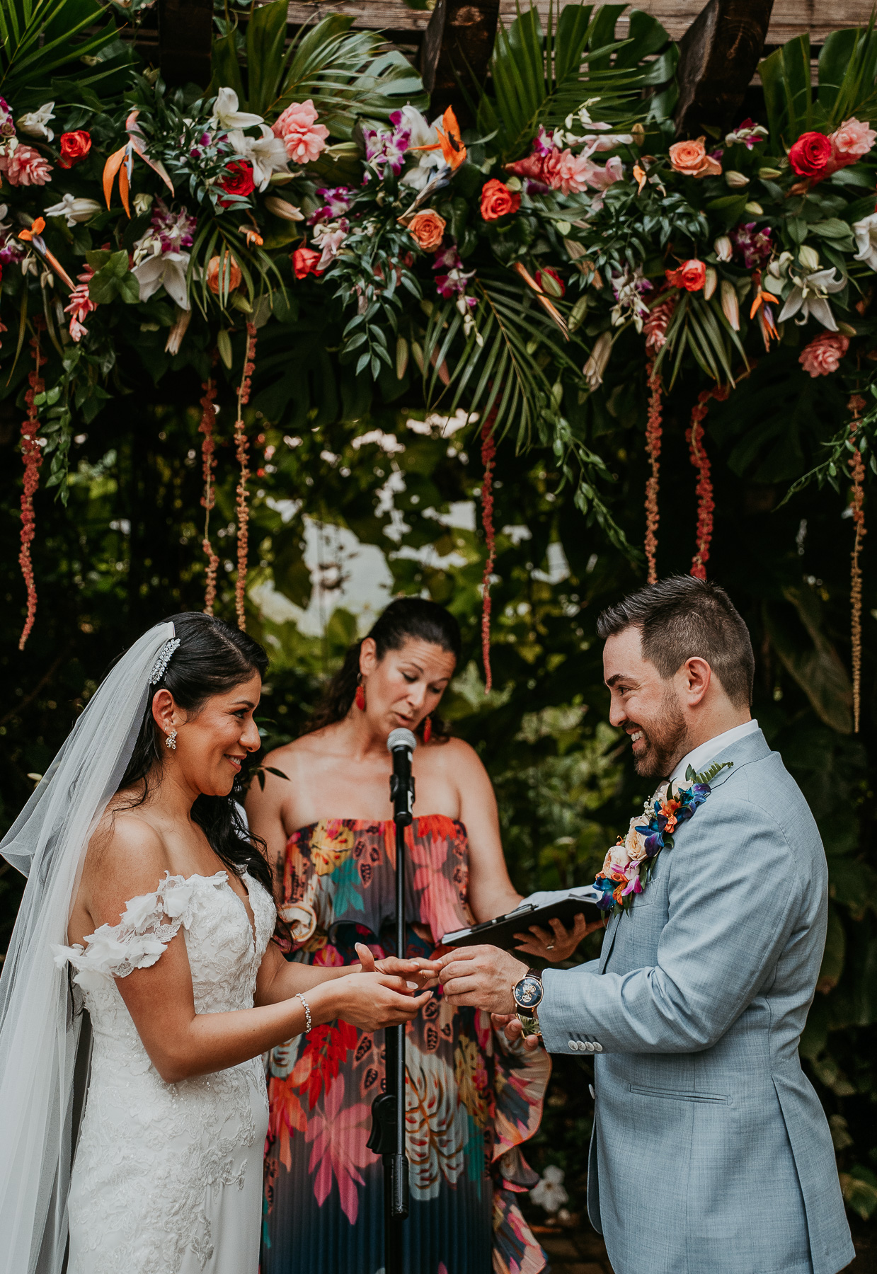 Romantic twilight wedding ceremony at Hacienda Siesta Alegre with guests seated under twinkling lights and lush greenery.