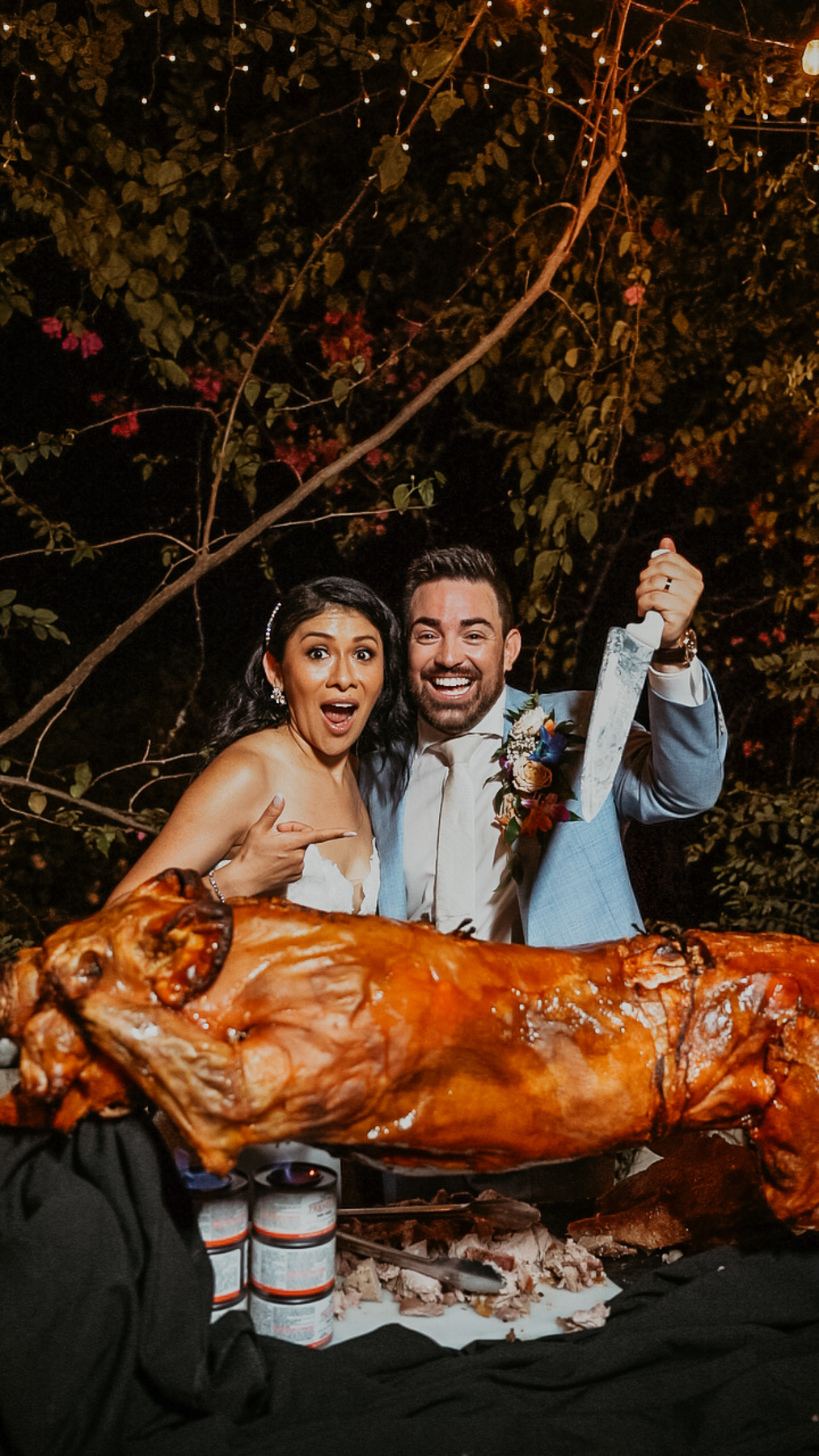 Delicious lechon asado centerpiece at the wedding reception, showcasing traditional Latin flavors and culinary heritage.