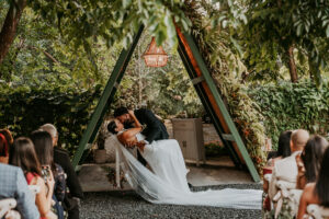 First kiss couple during wedding ceremony at Aldeana mountain venue