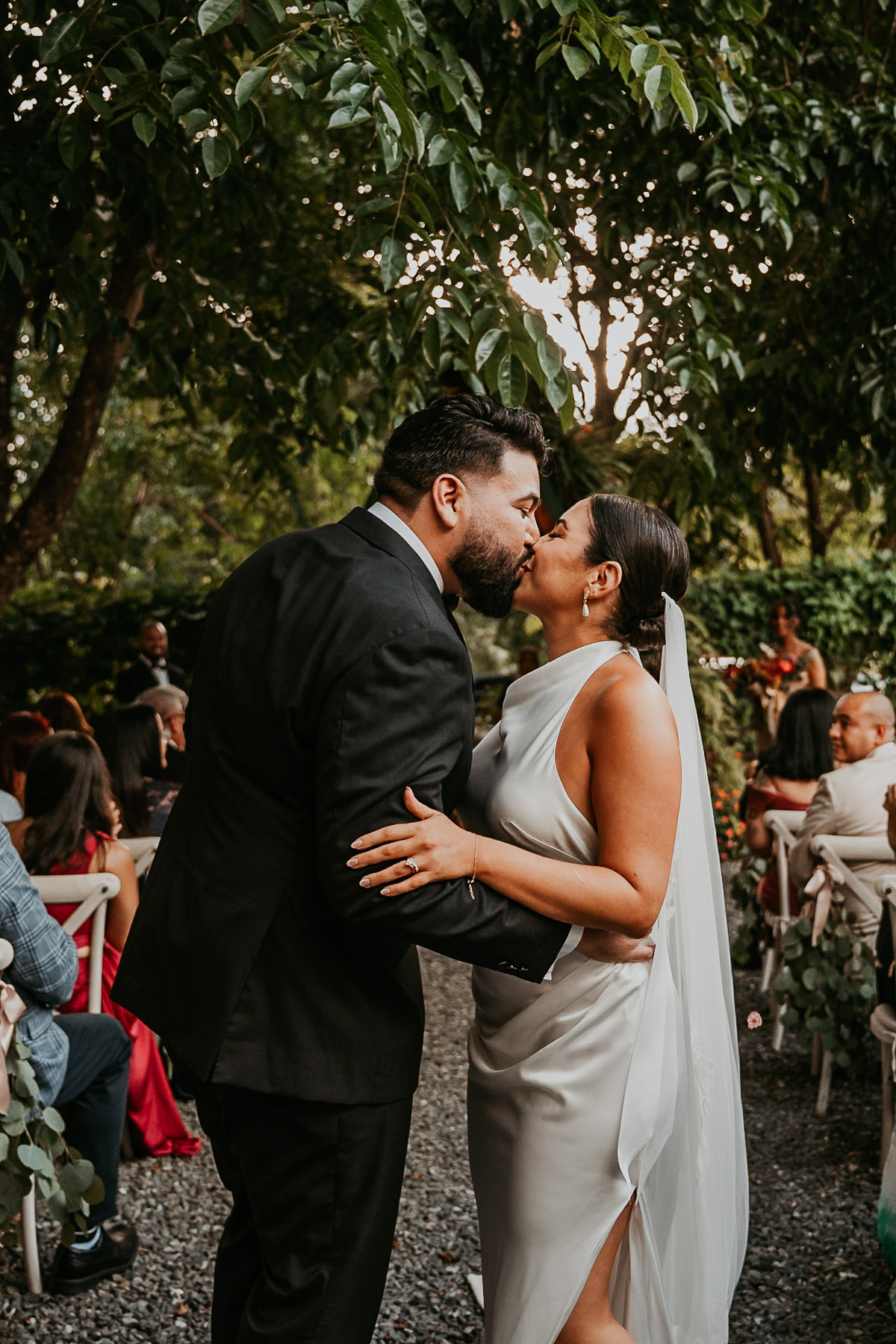 Couple kiss down the isle after wedding ceremony