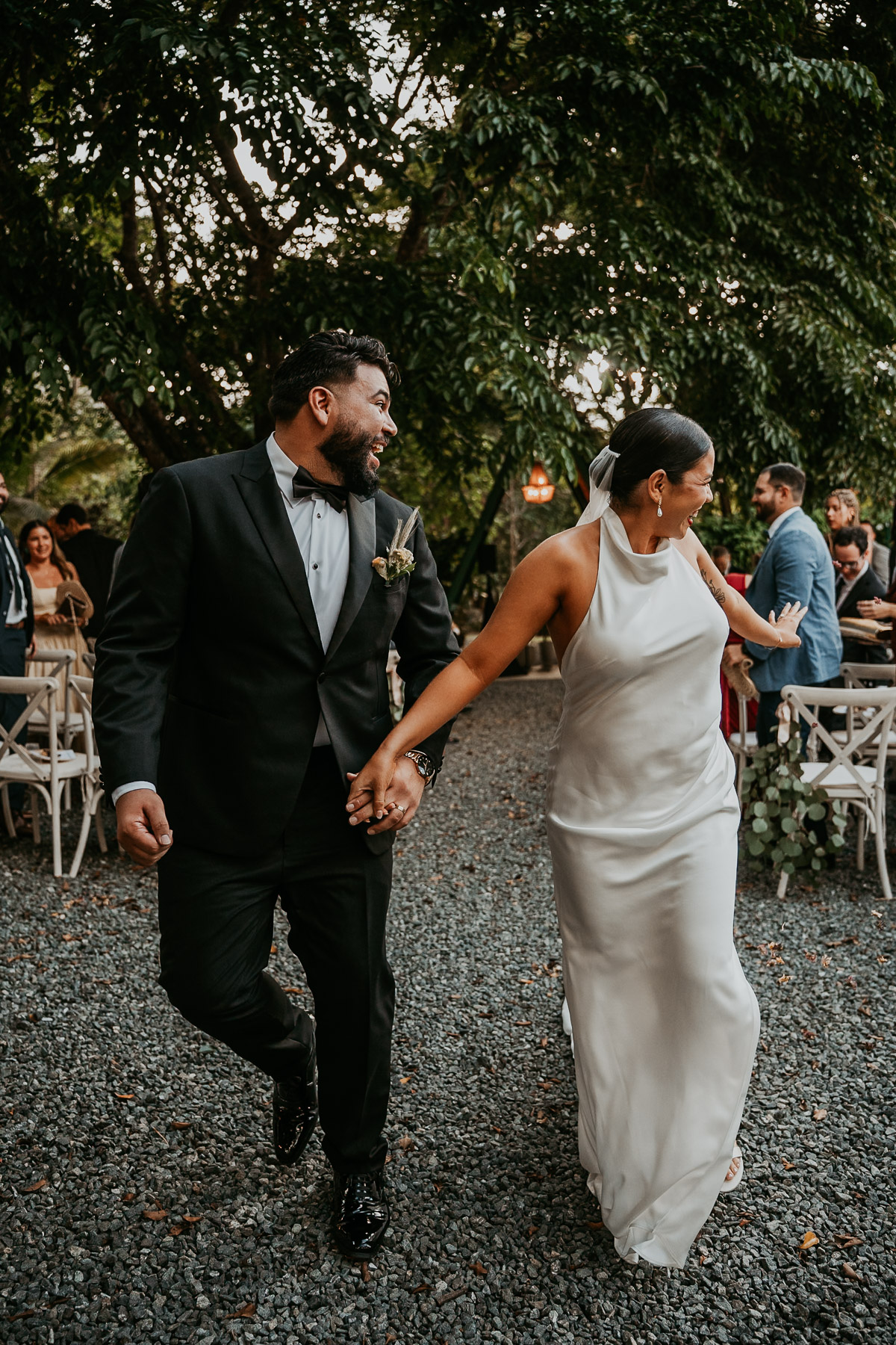 Couple running down isle after wedding ceremony at Aldeana