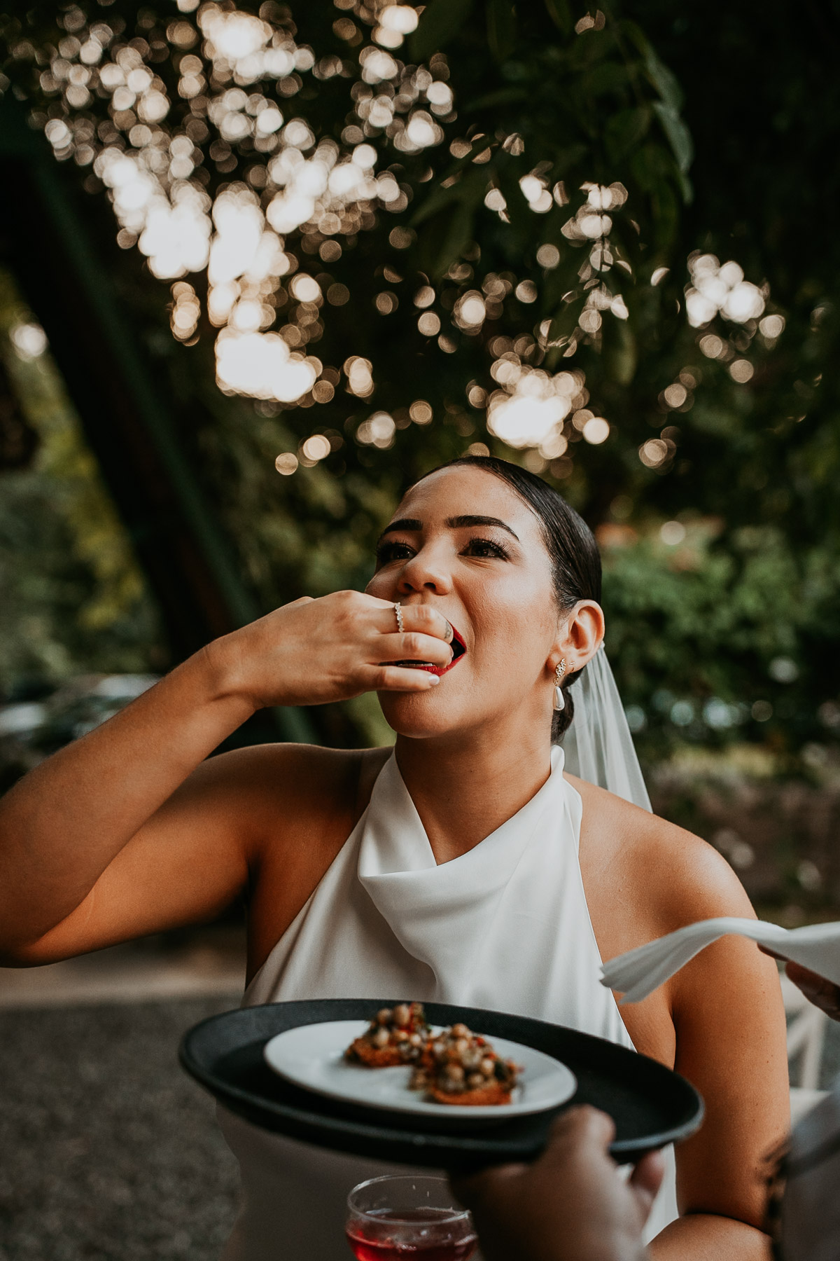 Bride enjoying artisanal catering featuring fresh, locally sourced ingredients prepared by native chefs at a mountain wedding venue in Cidra.