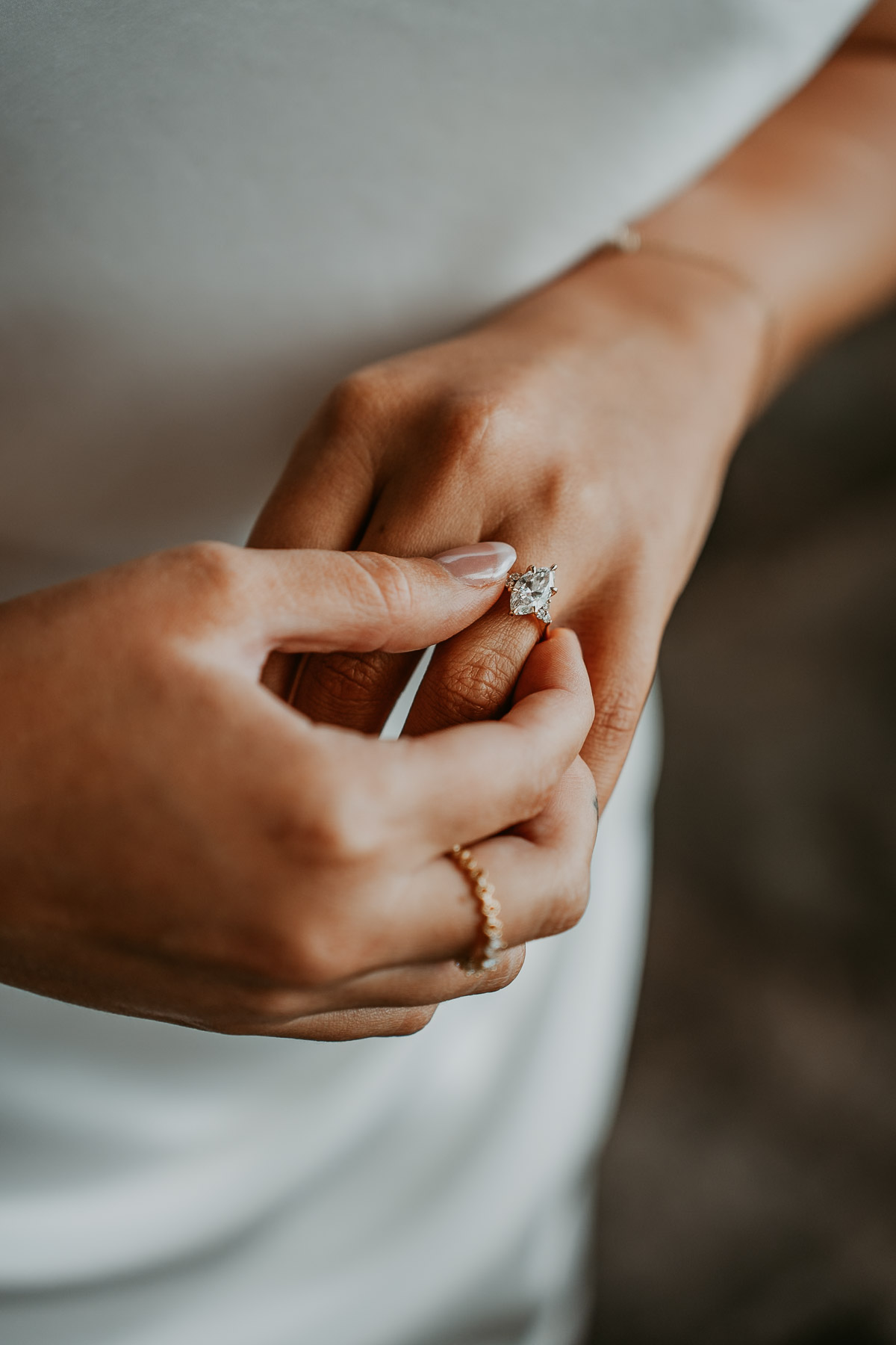 Bride holding wedding ring