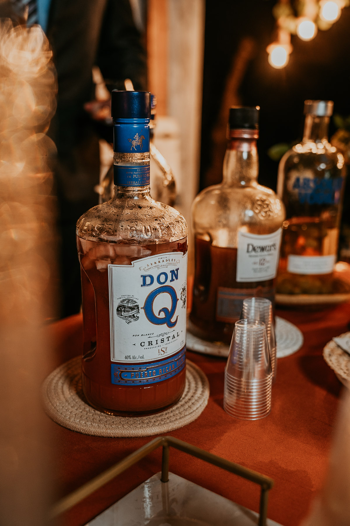 Boricua homemade local pitorro from the gancho bottle at a mountain reception.