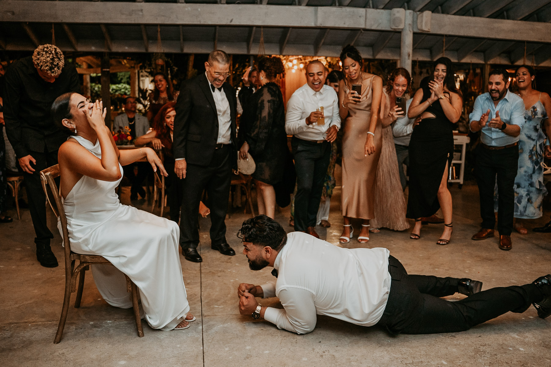 A fun, movement-filled snapshot of the garmet removal during an intimate wedding reception in Puerto Rico.