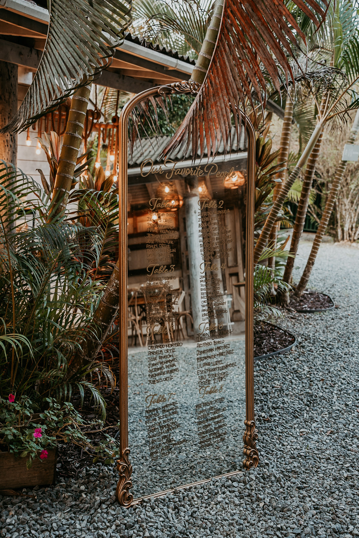 Rustic rattan decor and fresh tropical floral arrangements on tables at La Bromelia hall in Aldeana Cidra.