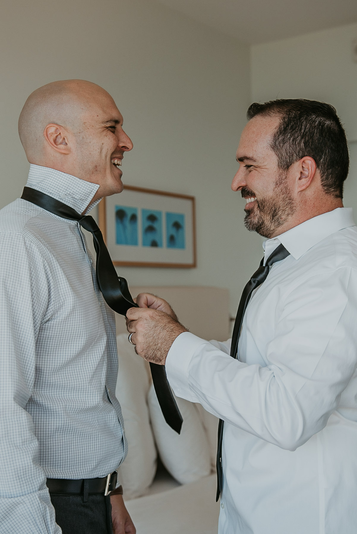 Daniel groom being helped by his groomsmen for his La Concha Wedding