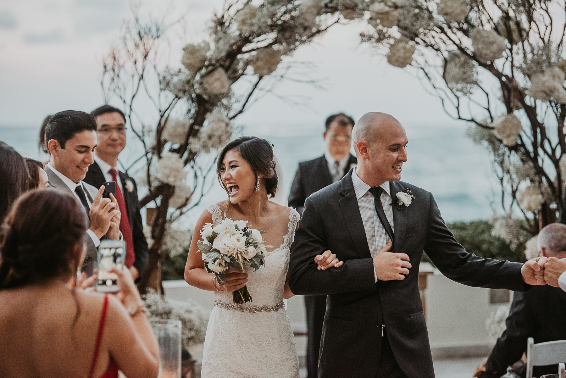 Bride and groom walking down the Isle.