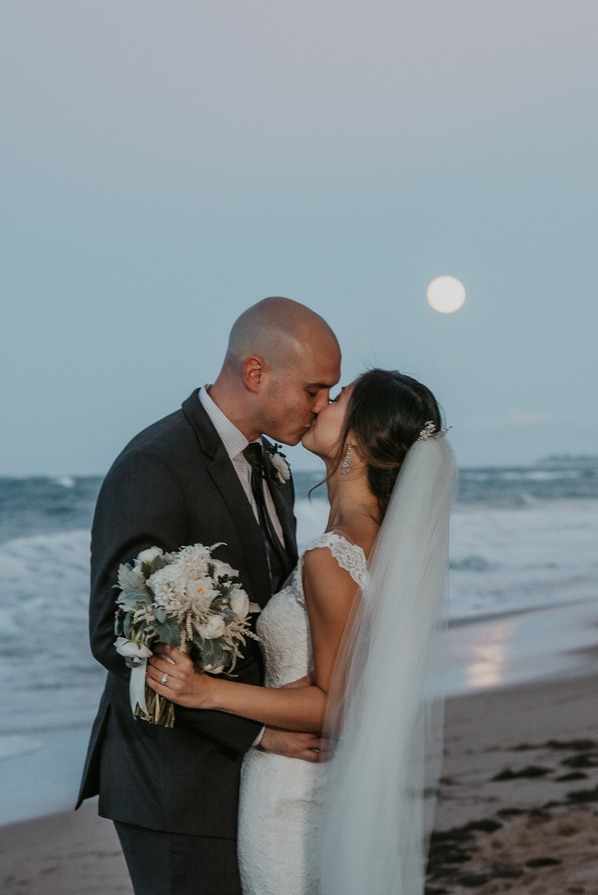 Bride and groom share a kiss underneath a Supermoon at La Concha Resort Wedding