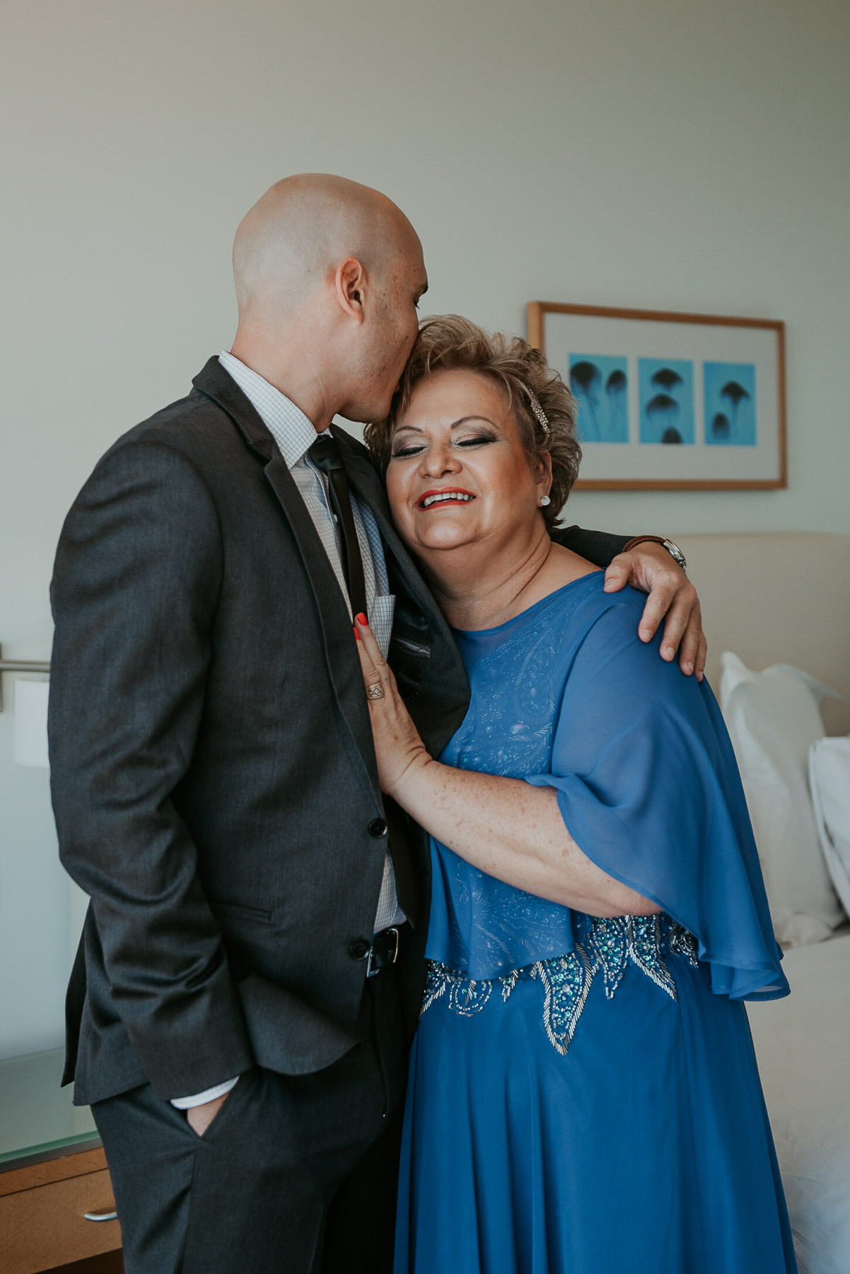 Groom kissing mom during his getting ready at La Concha Resort.