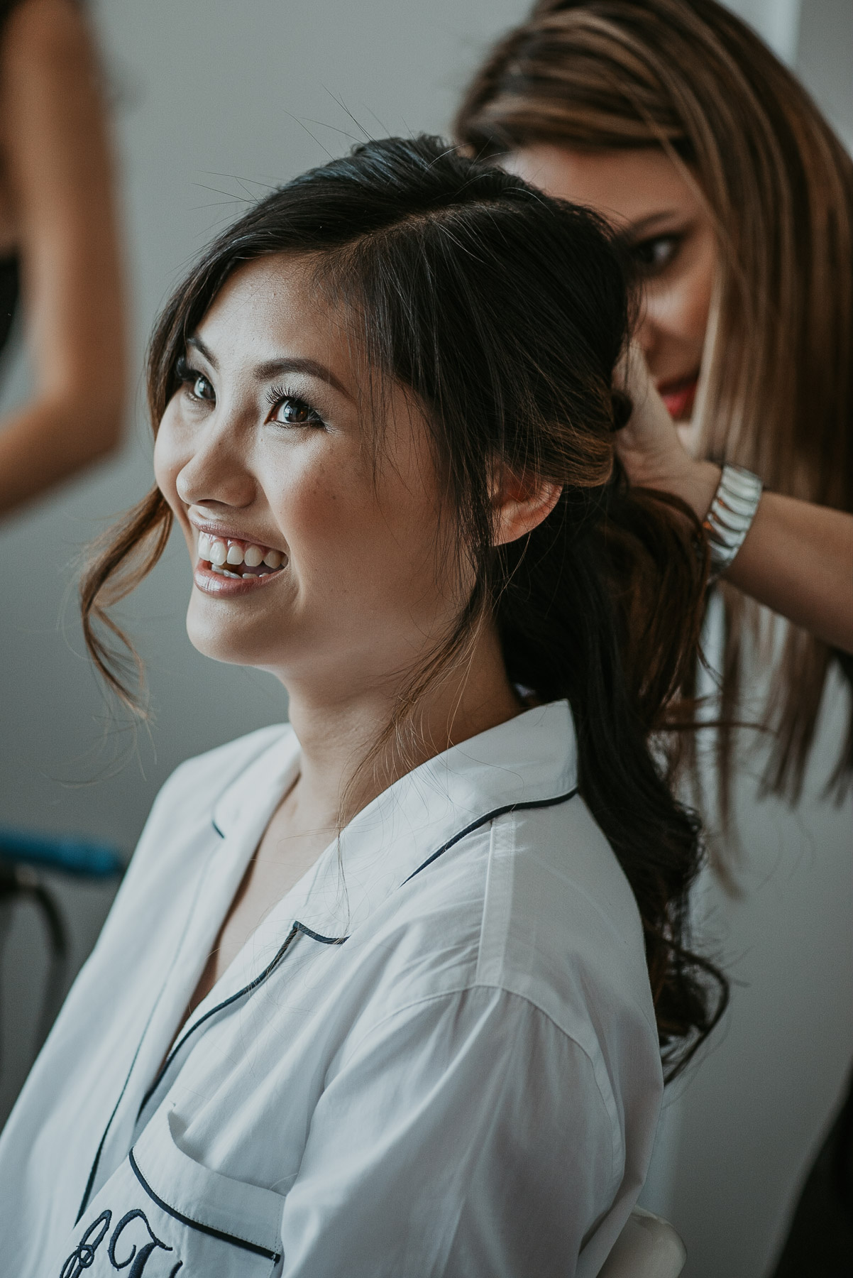 Bride getting hair and makeup done