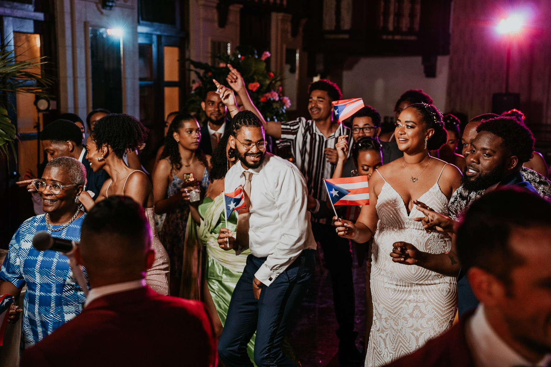 Bride and groom dancing with guest at Casa de España wedding.