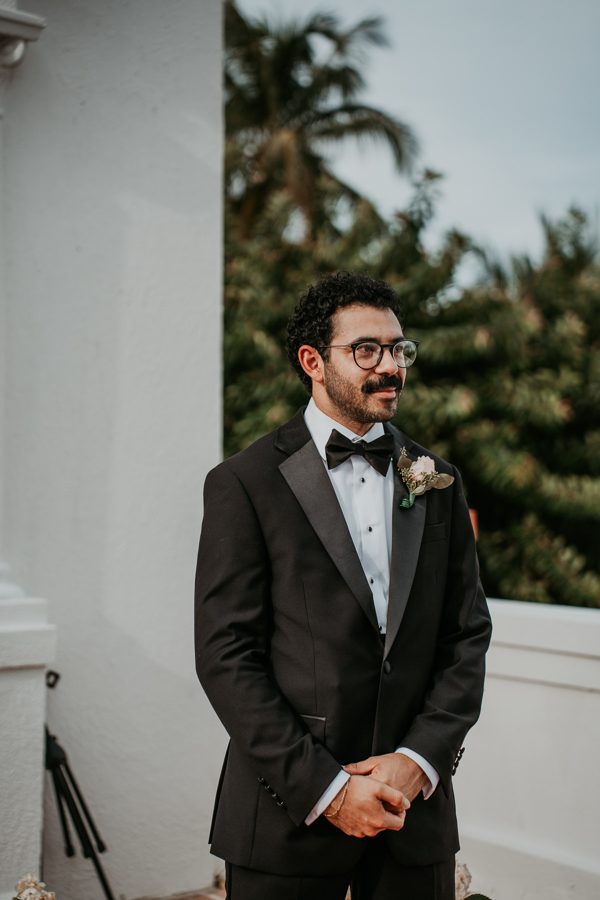 Groom waiting for bride at Casa de España rooftop ceremony