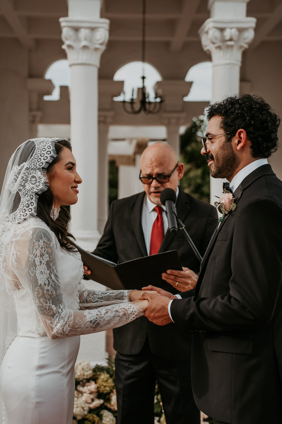 Couple exchanging vows during a Casa de España rooftop wedding in Puerto Rico