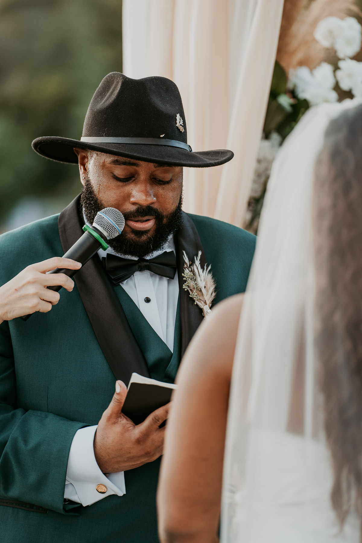Close up of groom with green suit during a beach tropical wedding in Puerto Rico.
