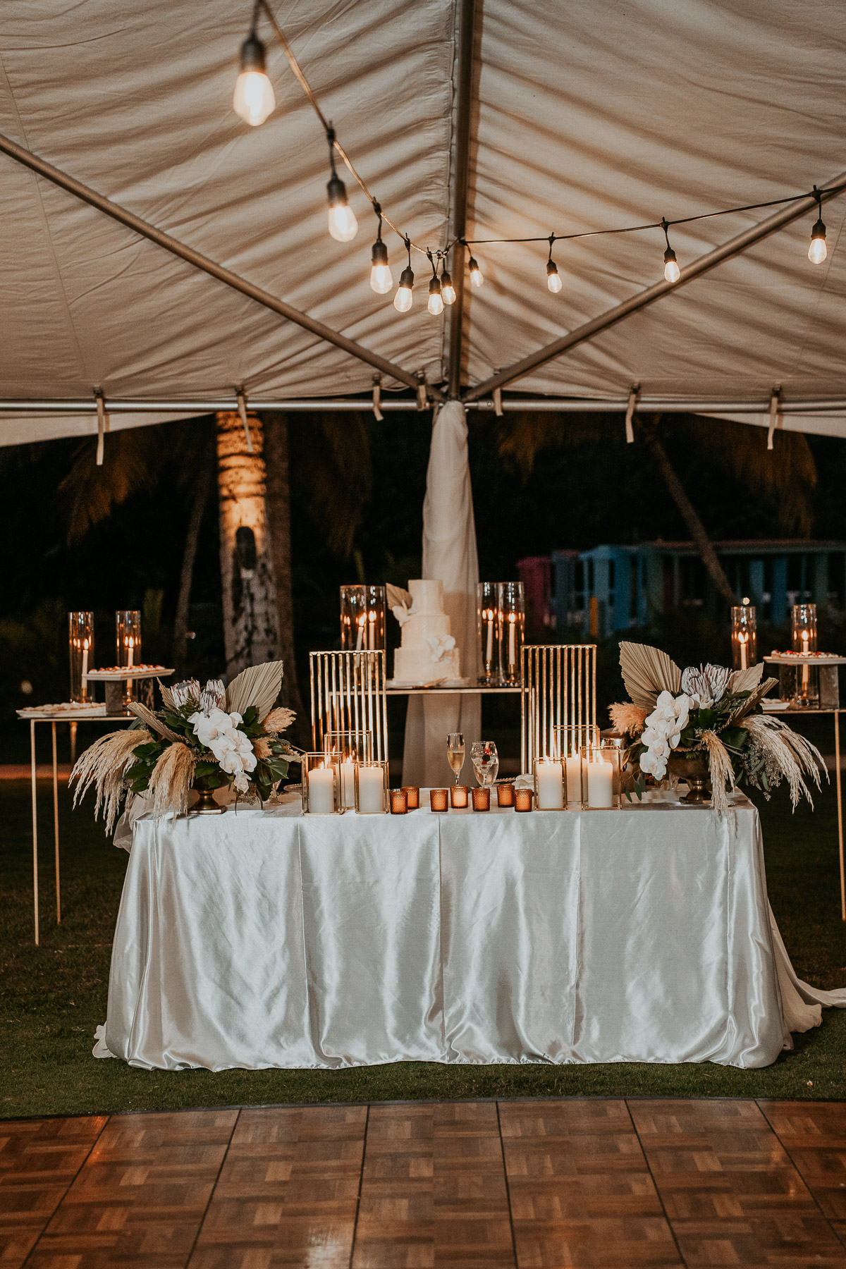 Wedding reception decor featuring tropical flowers and elegant floral arrangements.