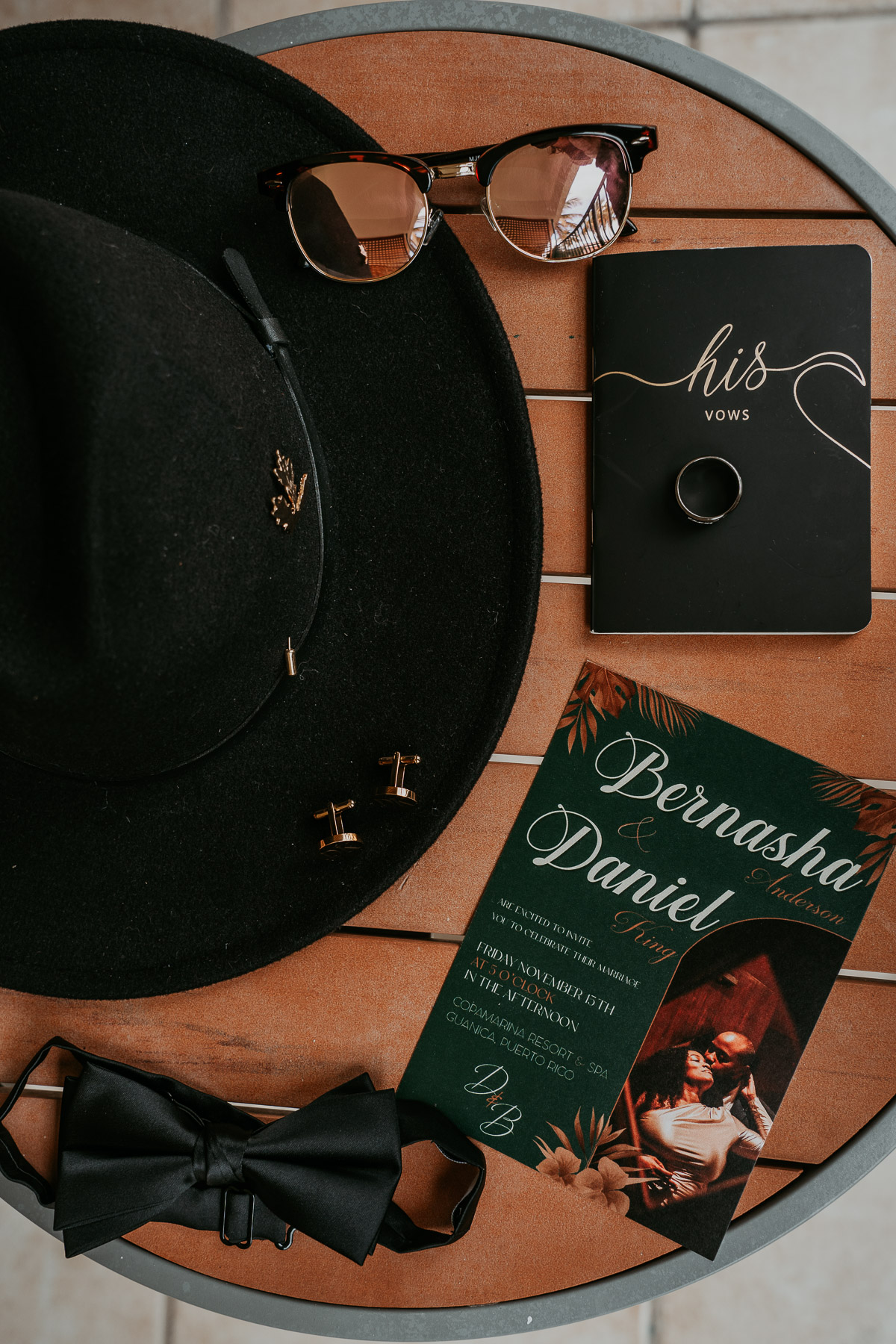 Groom's wedding details featuring his hat and formal accessories.