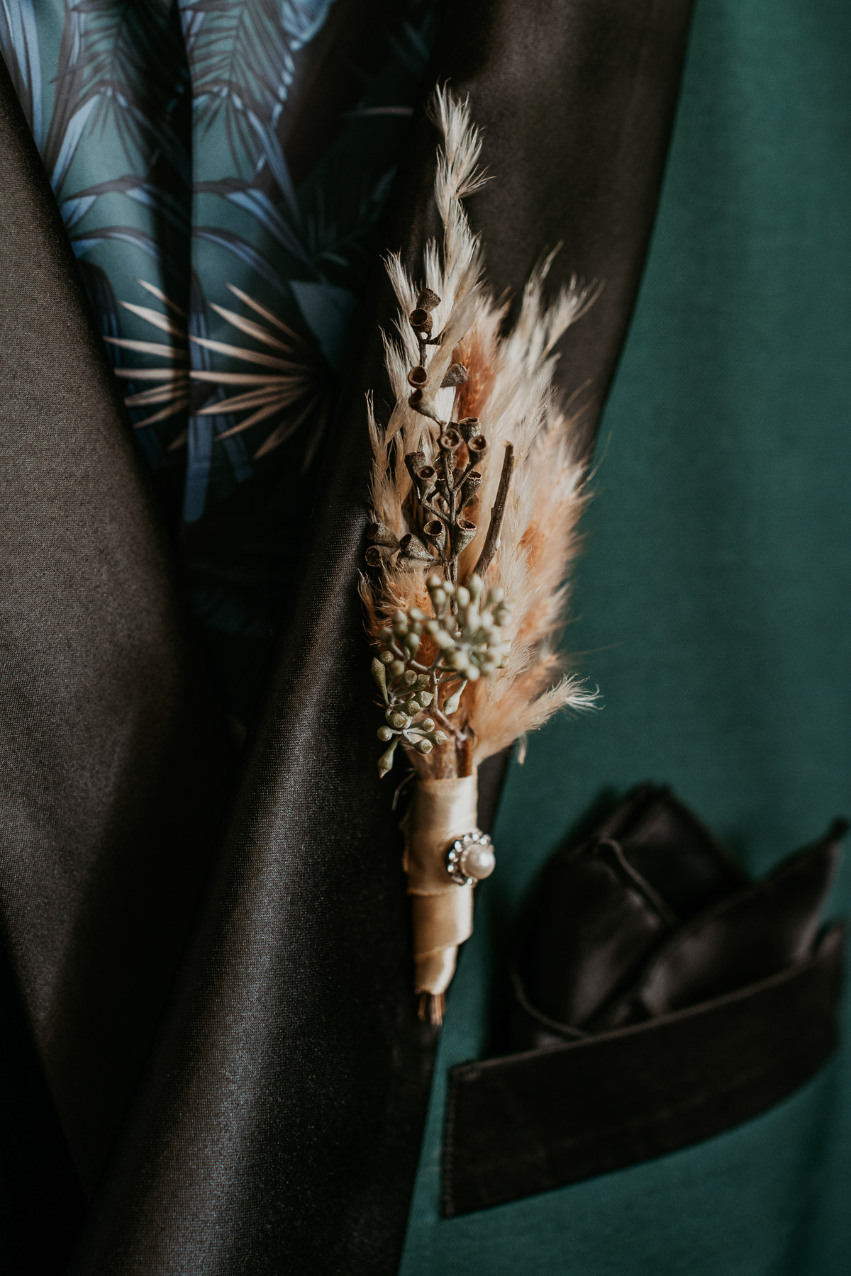 Close-up detail of the groom's boutonniere.