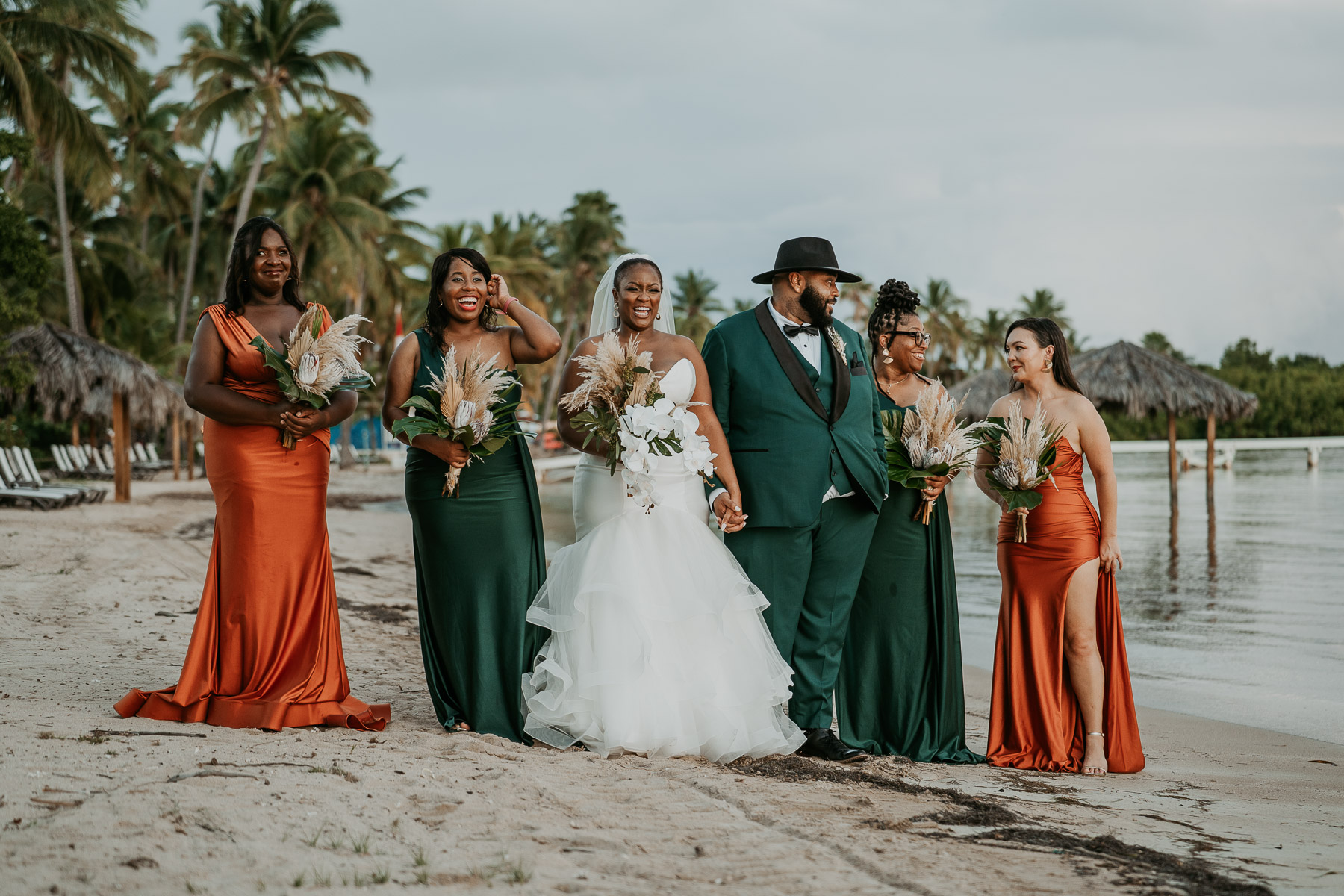 Wedding party gathered together for portraits along the beach in Puerto Rico.