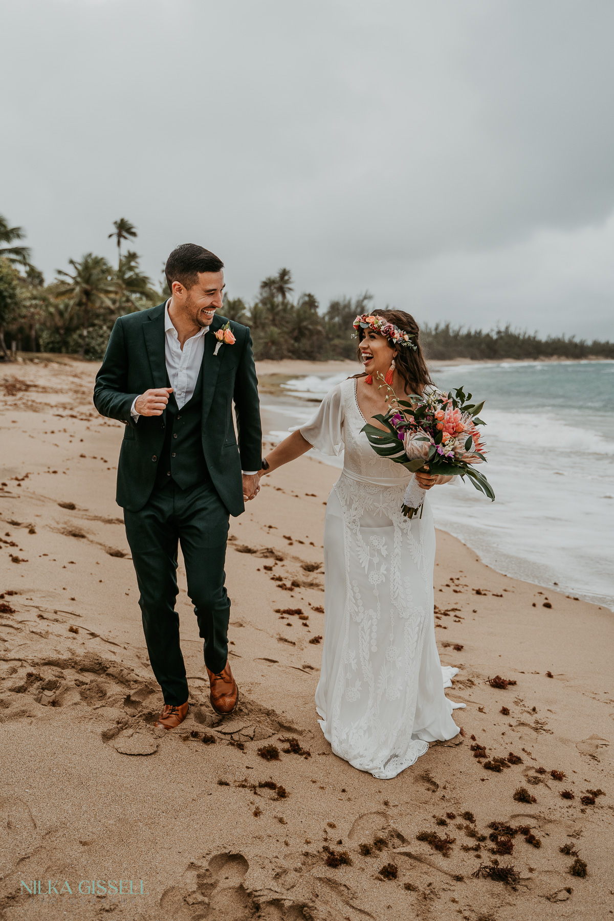 A couple running at the beach after getting married in Puerto Rico.