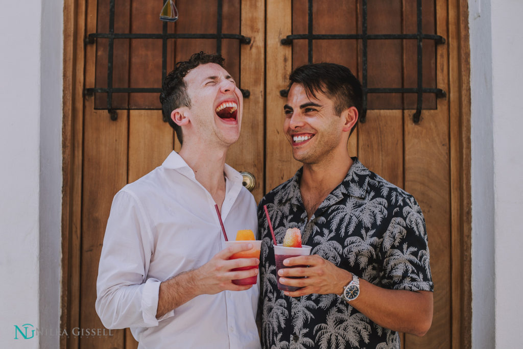 LGBTQ+ Couple Eating a Piragua at Old San Juan Engagement Session.