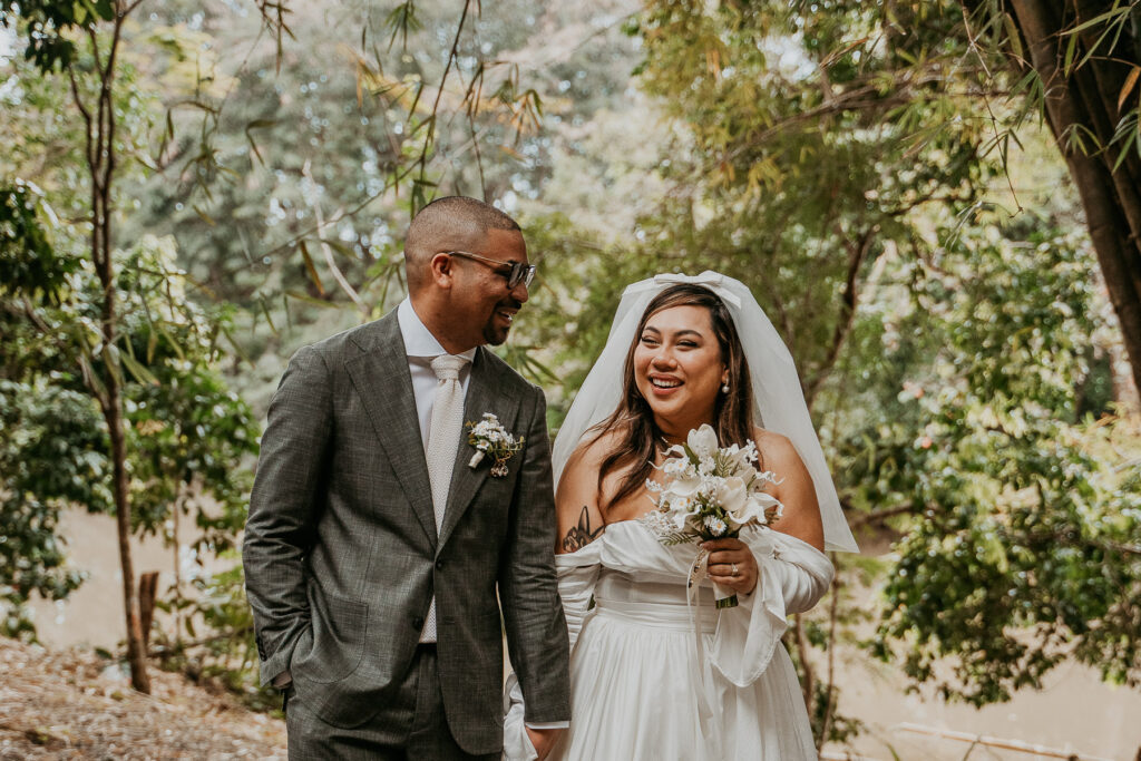 Bride and groom walking happily after saying I do at Dos Aguas Elopement.