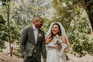 Bride and groom walking happily after saying I do at Dos Aguas Elopement.