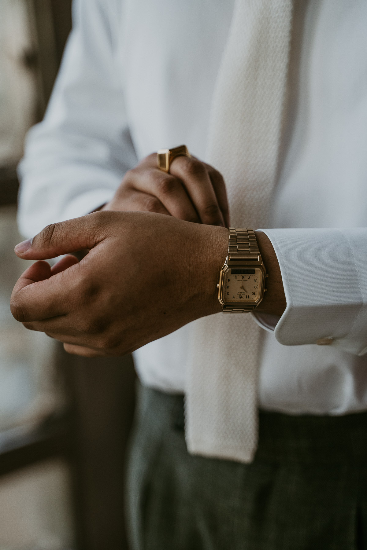 Groom fixing watch at Dos Aguas Elopement.