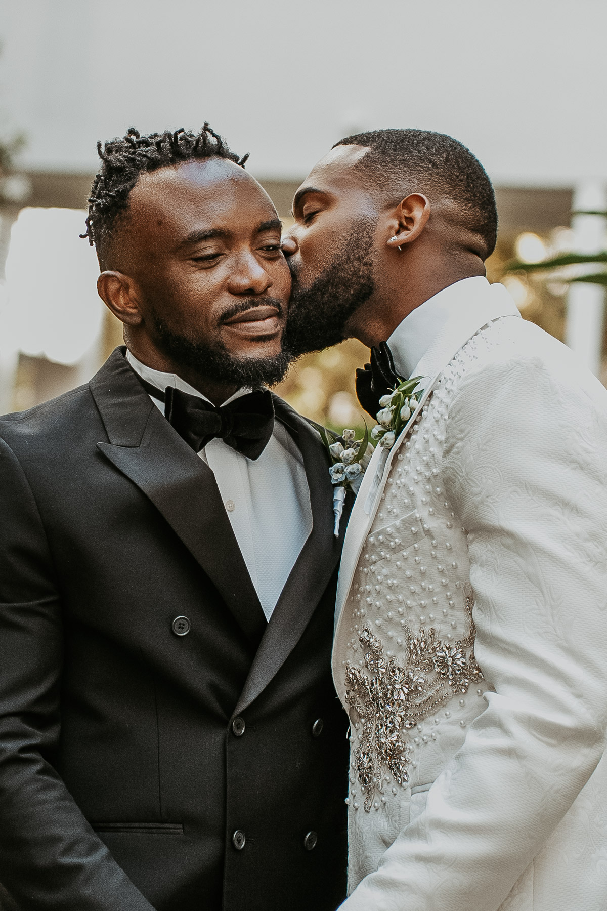 Wedding kiss between two grooms at El Conquistador Resort Puerto Rico