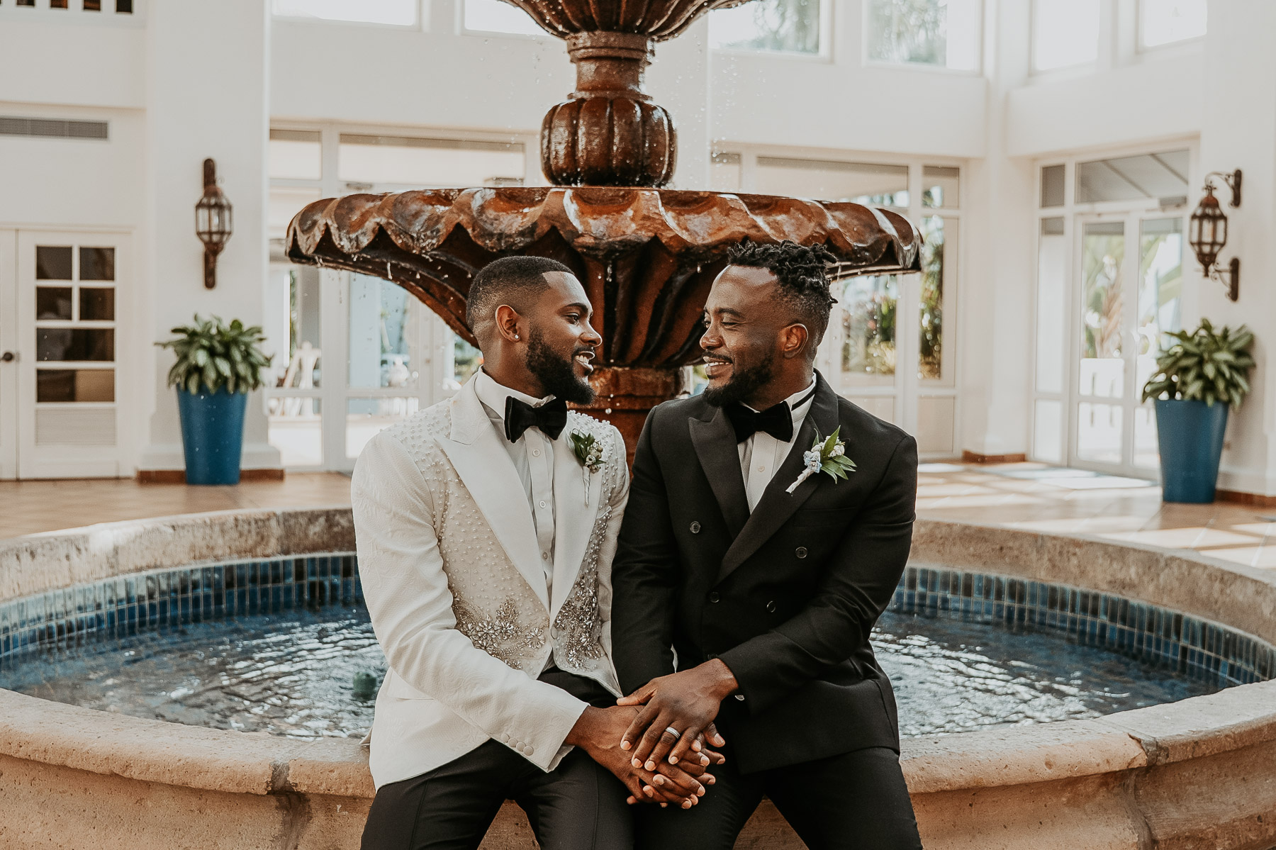Couple embracing in front of fountain at Puerto Rico wedding venue