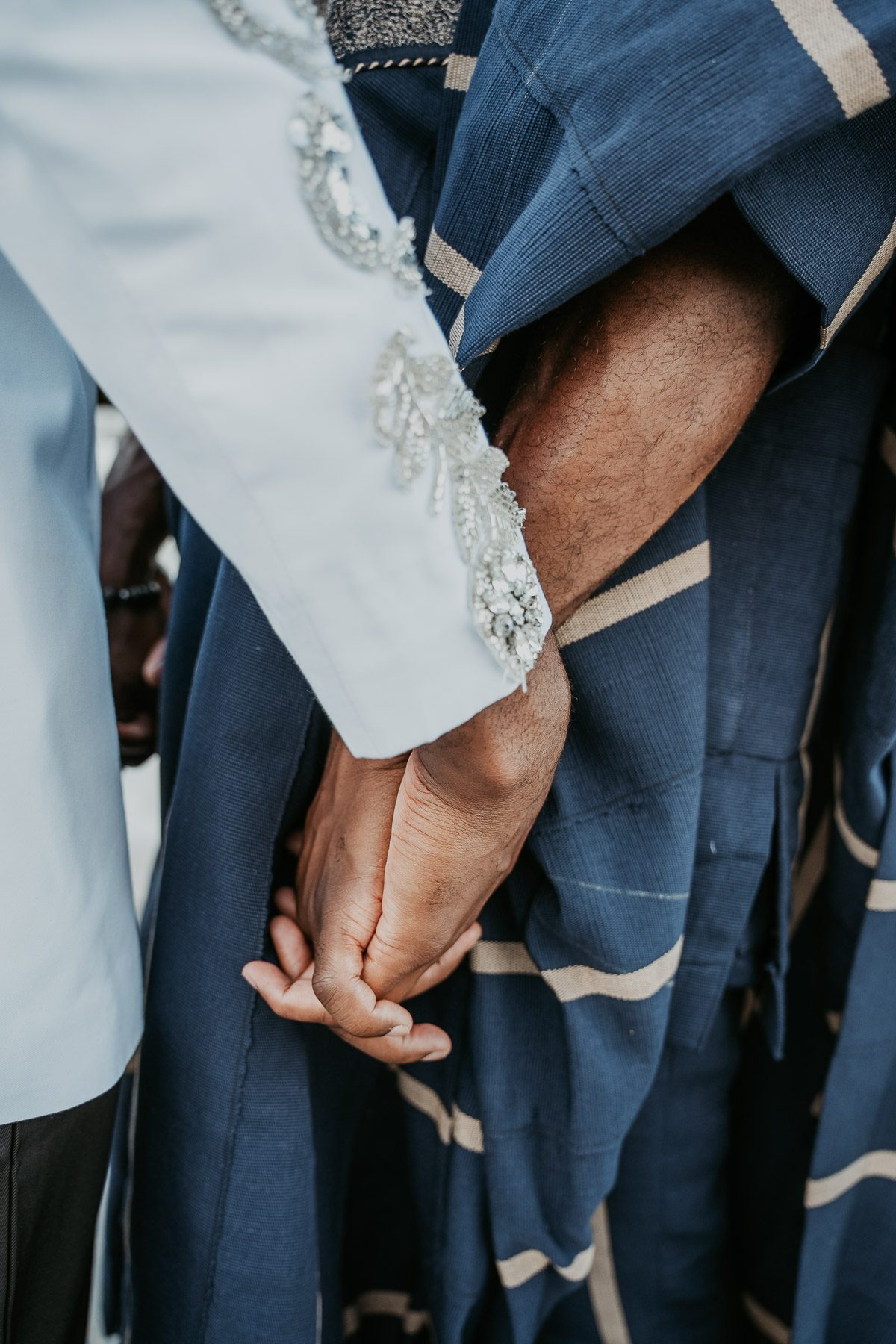 Couple holding hands during golden light portrait session in Fajardo