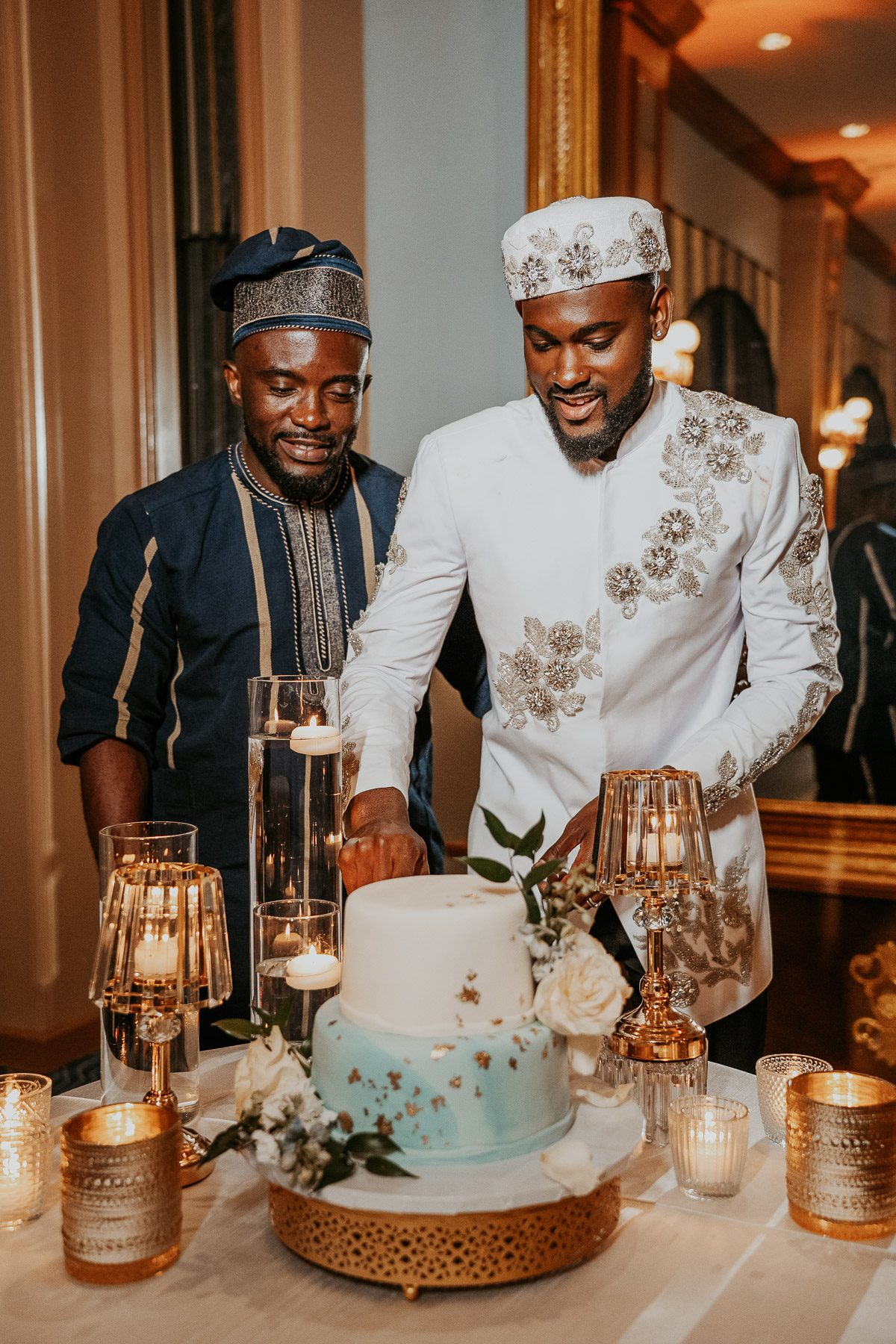 Two grooms cutting their wedding cake at Puerto Rico destination wedding celebration