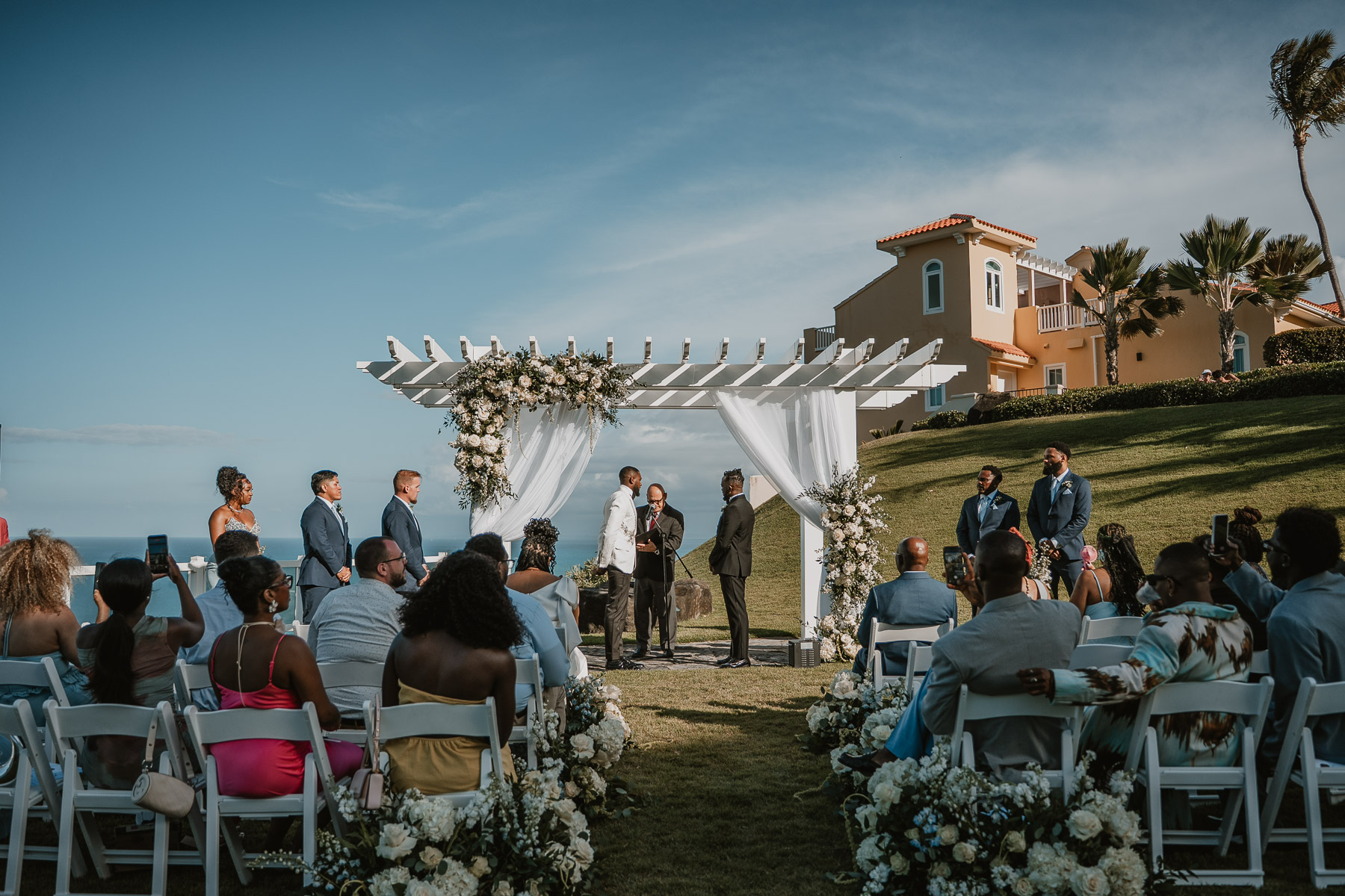 Outdoor wedding ceremony at El Conquistador Resort with ocean views in Fajardo