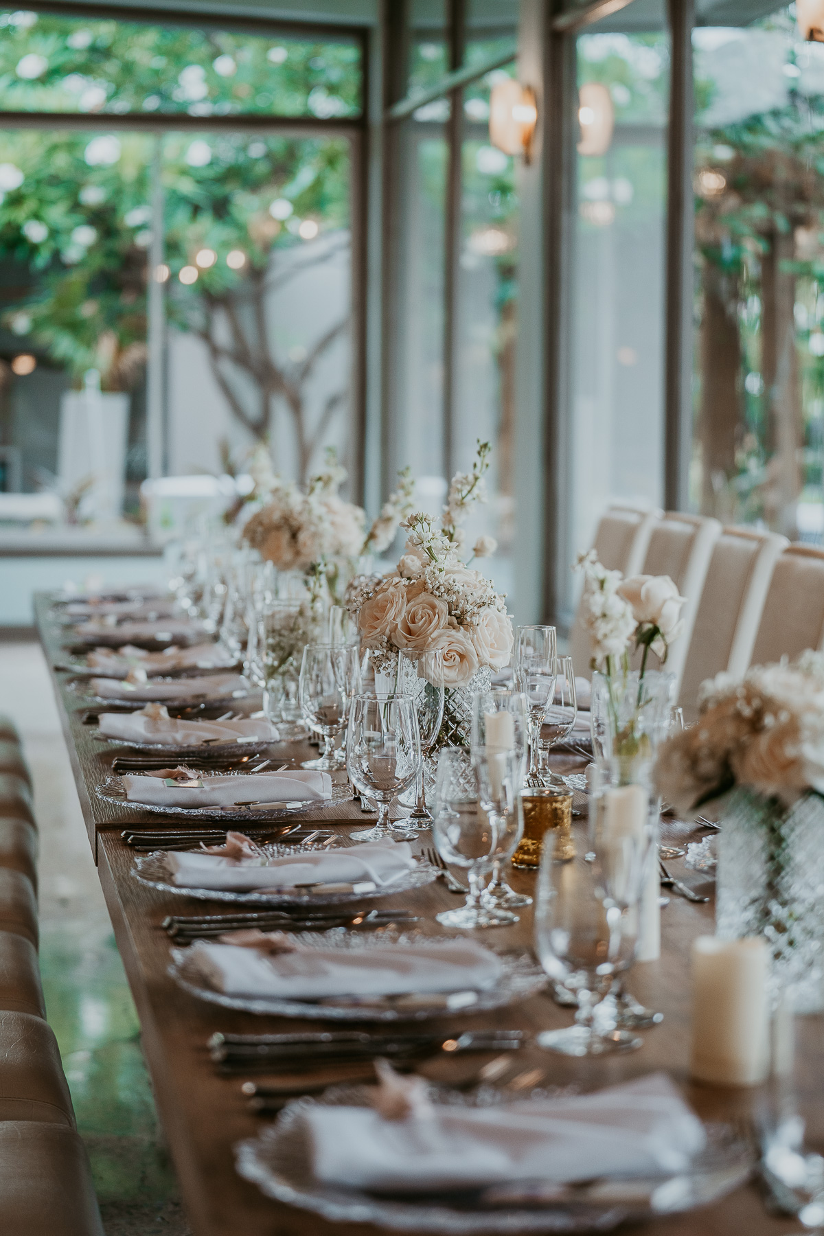 Wedding reception table adorned with white florals at Copamarina Beach Resort.