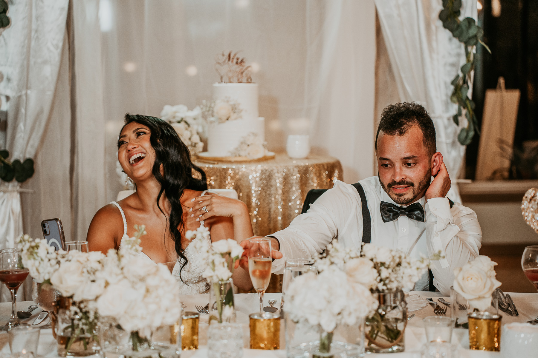 Newlyweds sharing a romantic moment under the palm trees at Copamarina Beach Resort