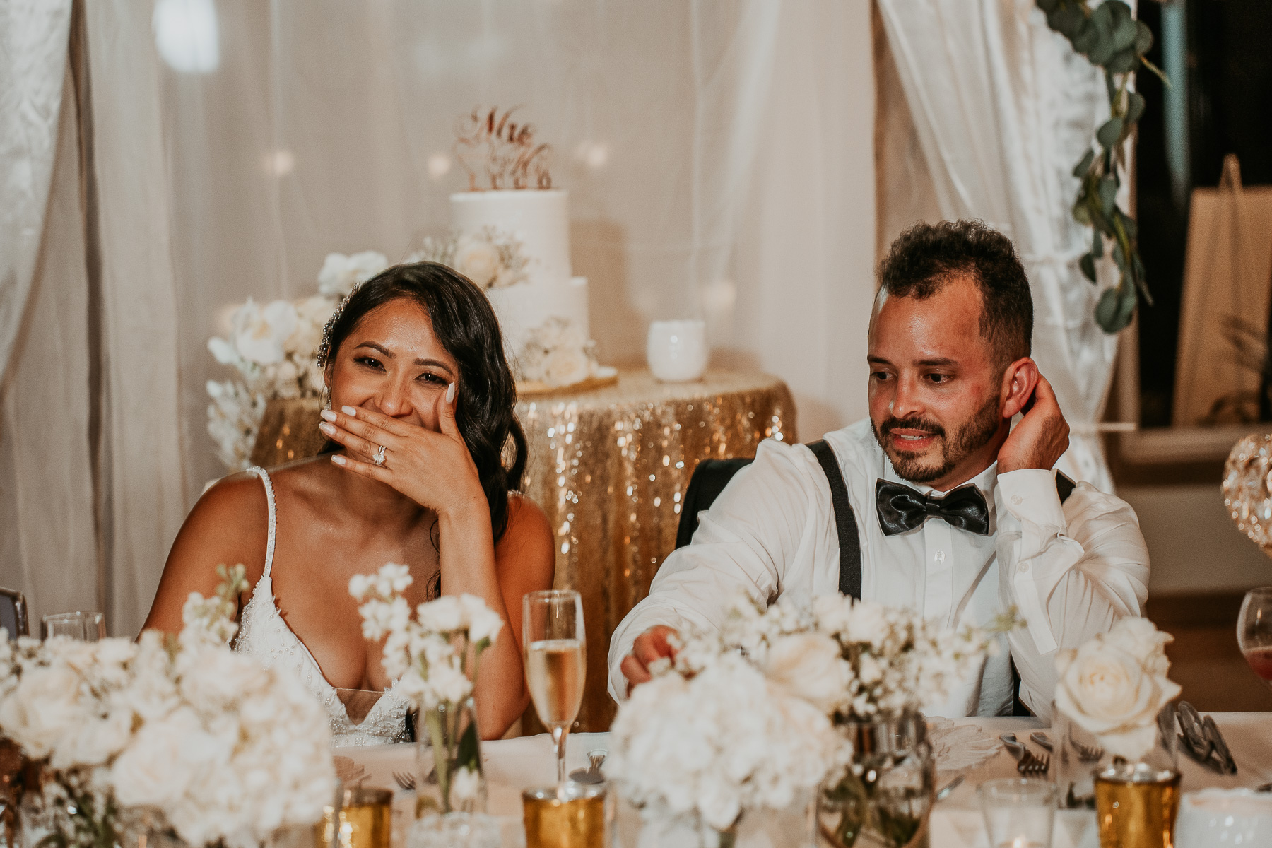 Newlyweds sharing a romantic moment under the palm trees at Copamarina Beach Resort