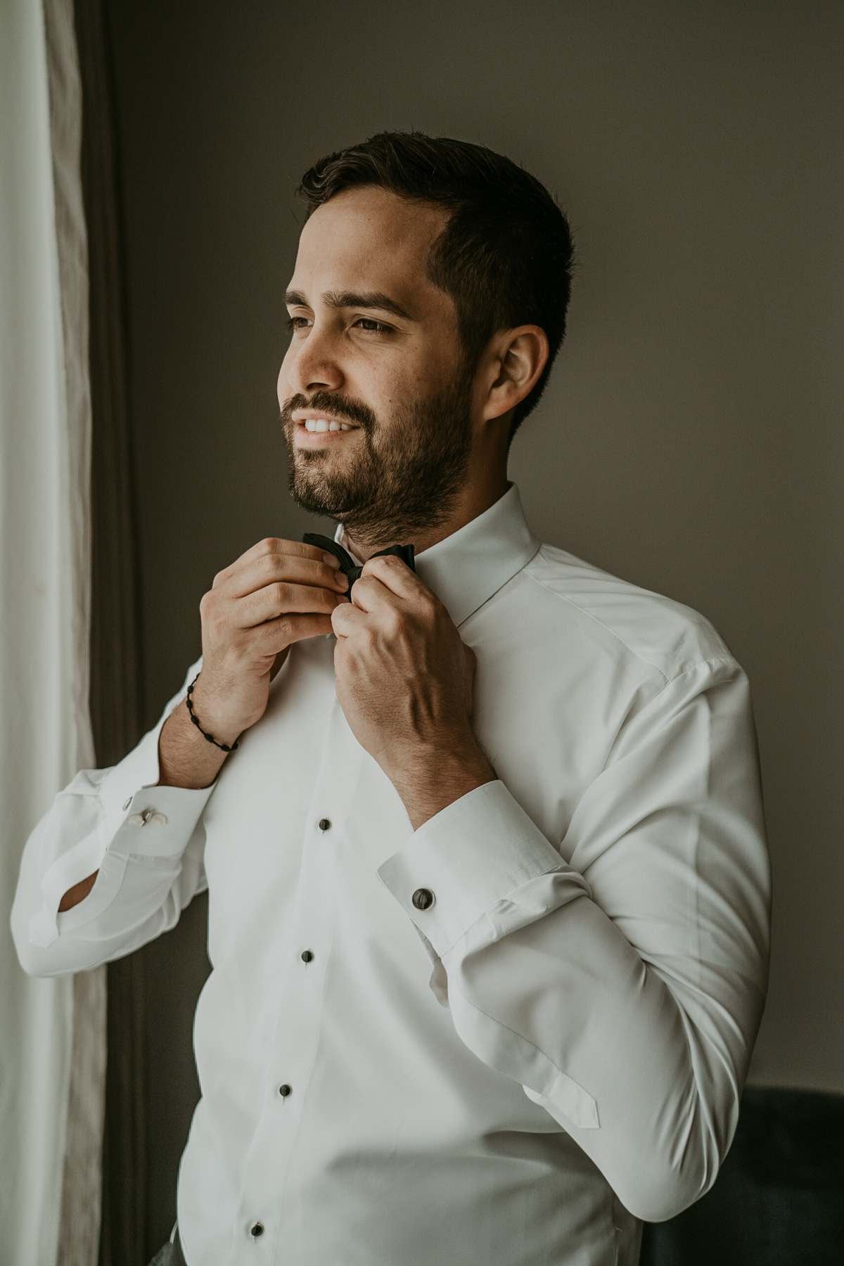 Groom getting ready at Fairmont El San Juan Hotel