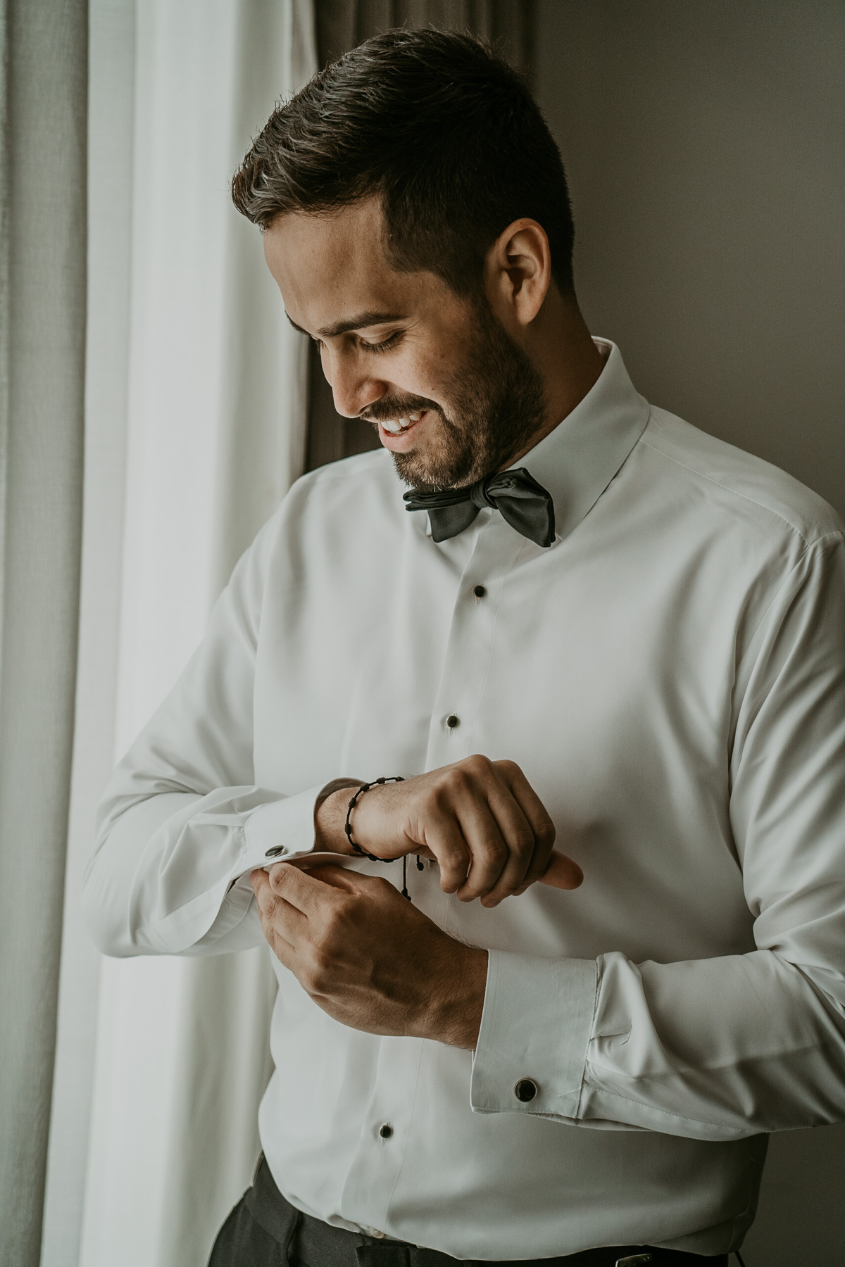 Groom getting ready at Fairmont El San Juan Hotel