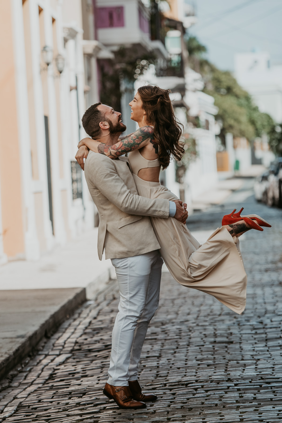 Groom lifting bride during their elopement in Puerto Rico.