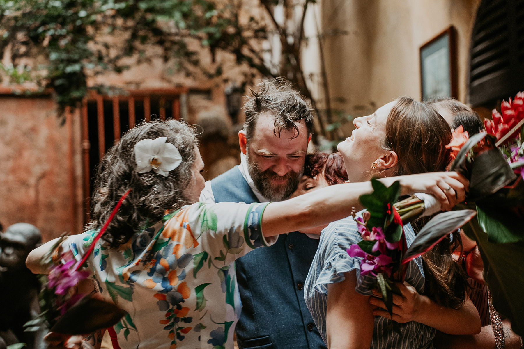 Couple laughing with close friends during intimate elopement in Old San Juan Puerto Rico