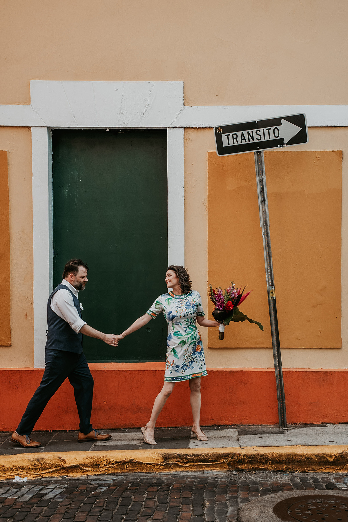Candid wedding photographer capturing couple exploring Old San Juan together