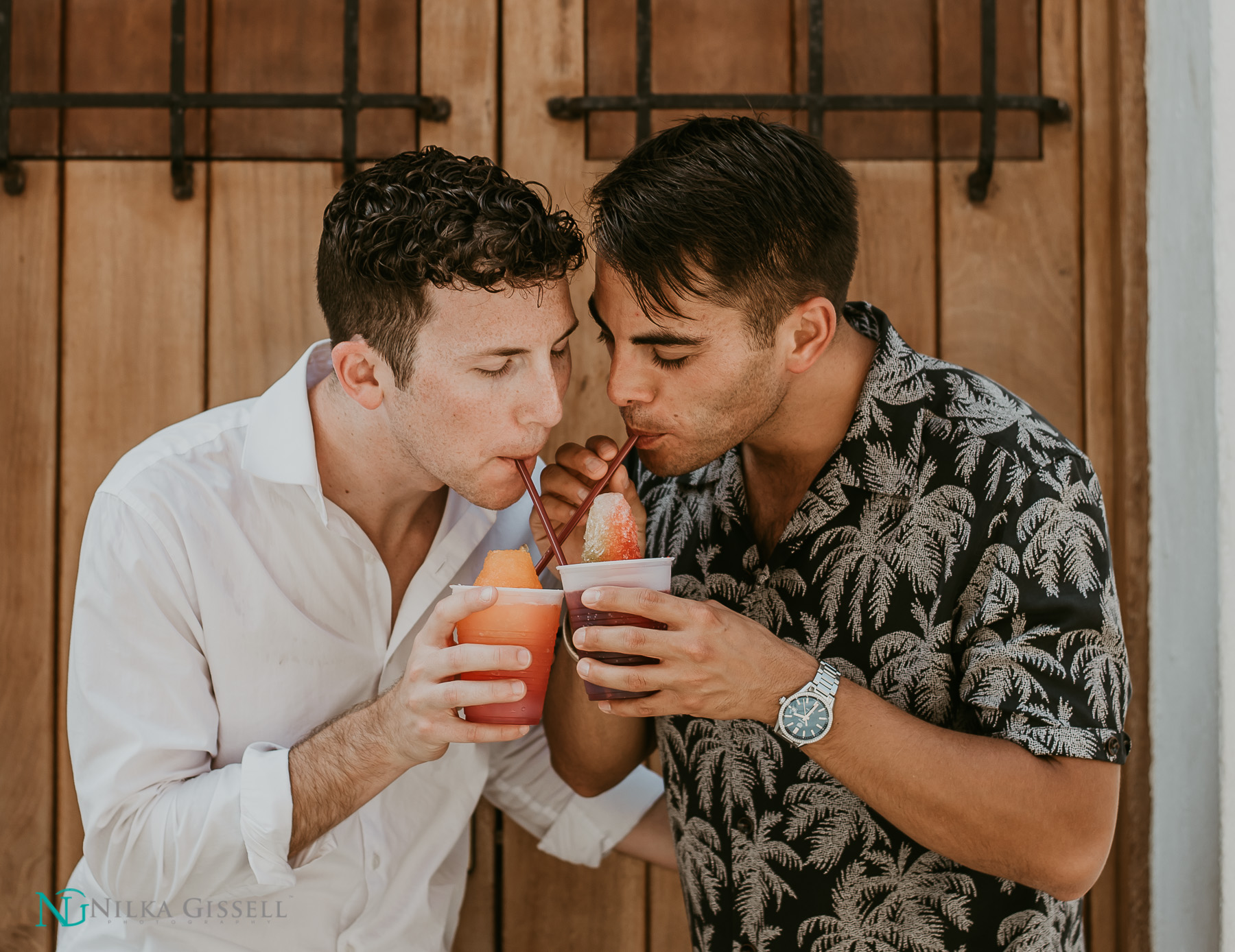 LGBTQ+ Couple eating a Piragua at Old San Juan Engagement Session.