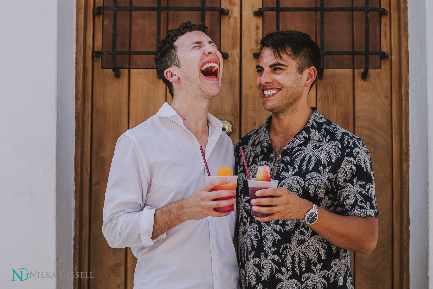 Gay Couple Laughing Eating Piragua at Old San Juan Engagement