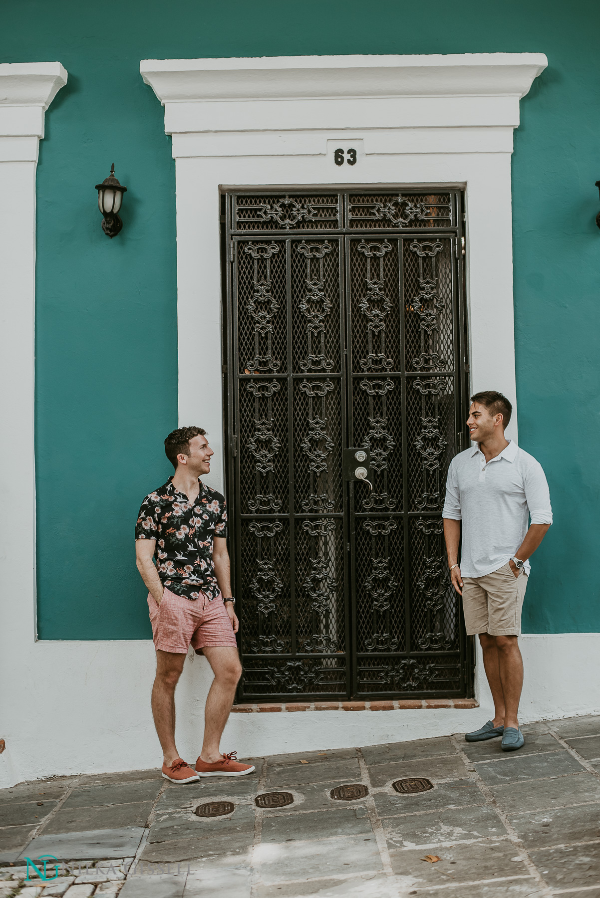 LGBTQ+ Couple Looking at Each Other during Old San Juan Engagement Session.