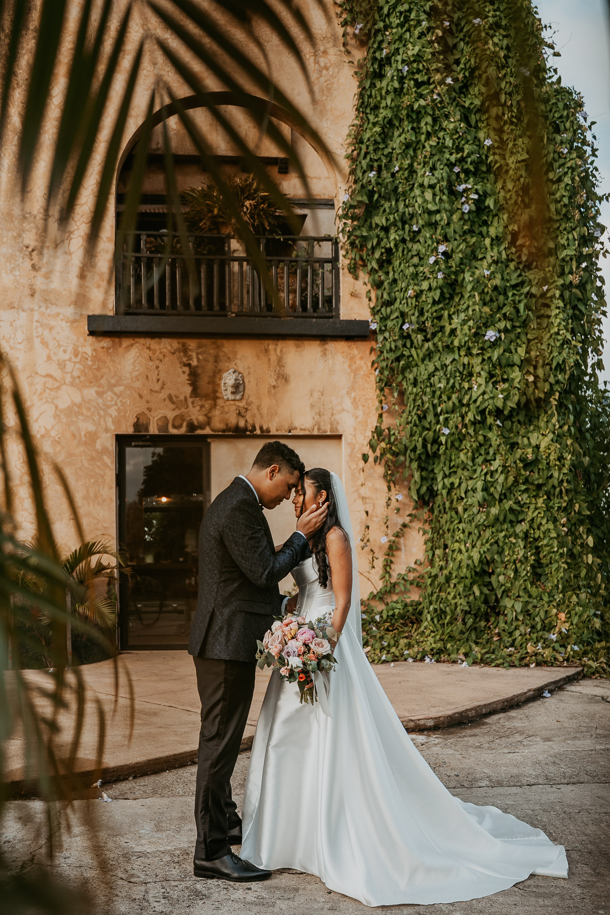 Bride and groom portraits with Spanish colonial architecture at Hacienda Campo Rico.