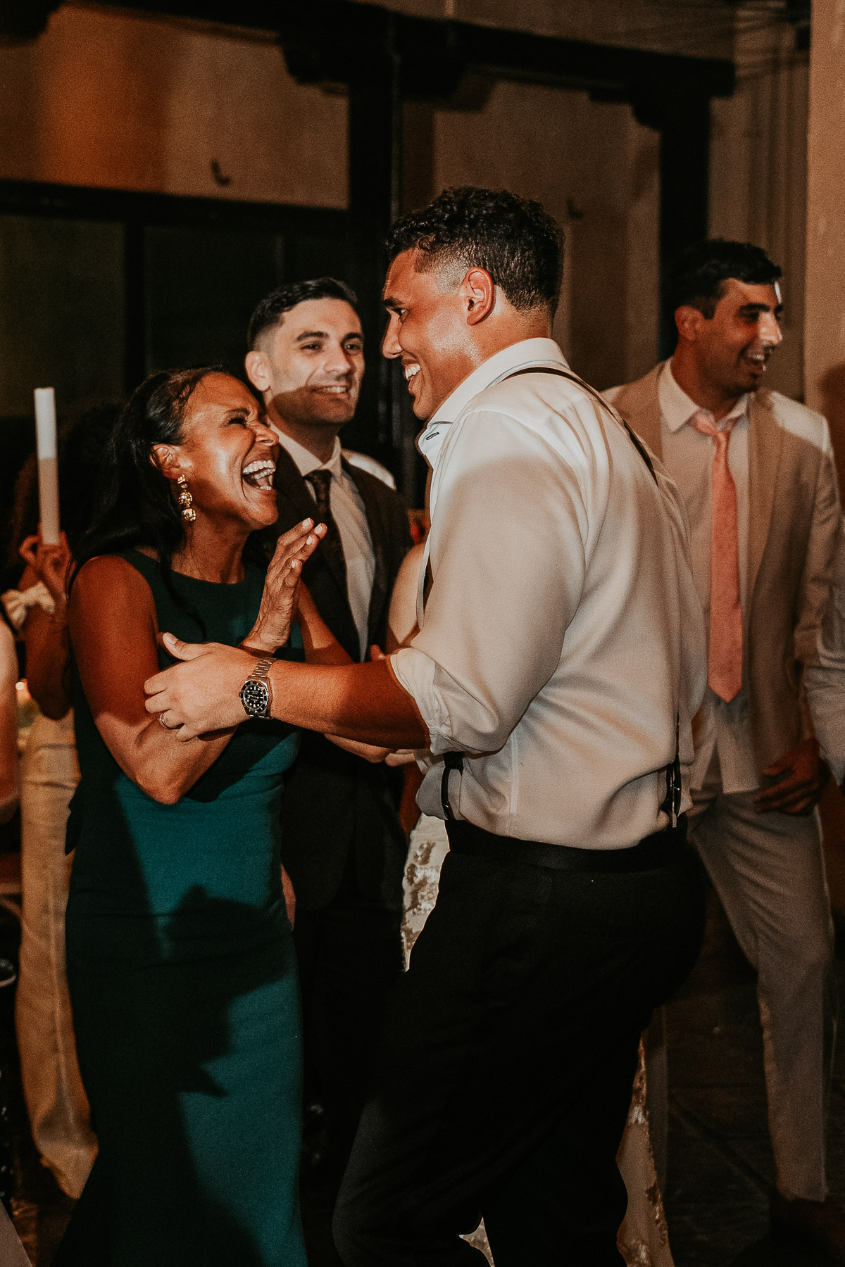 Groom dancing with his mother during lively Hacienda Campo Rico wedding reception.